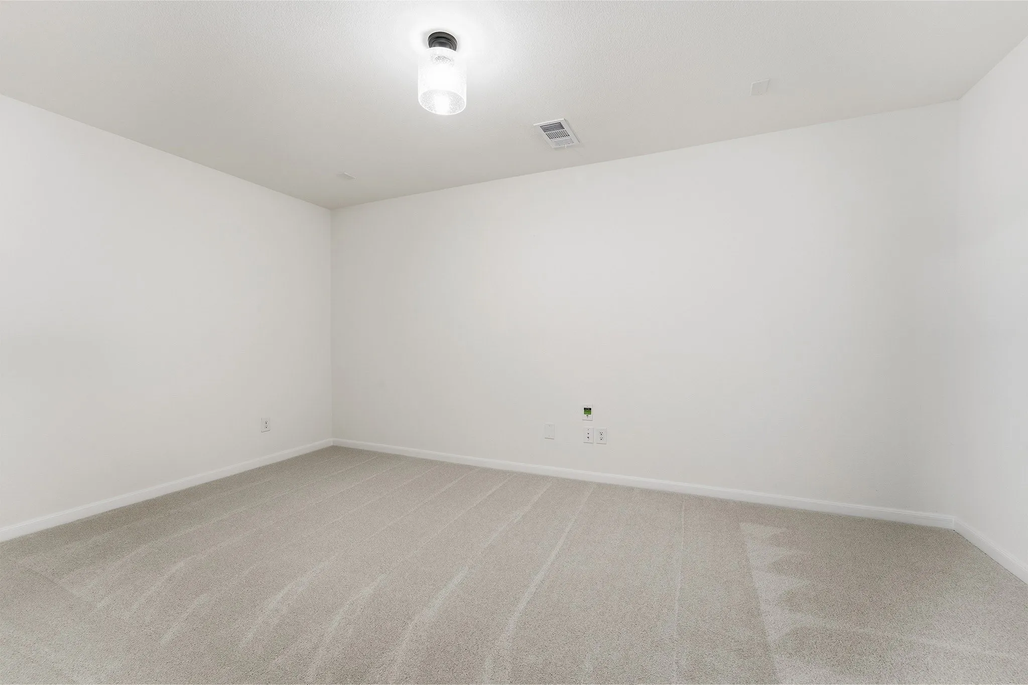 Light-toned carpeting and neutral walls