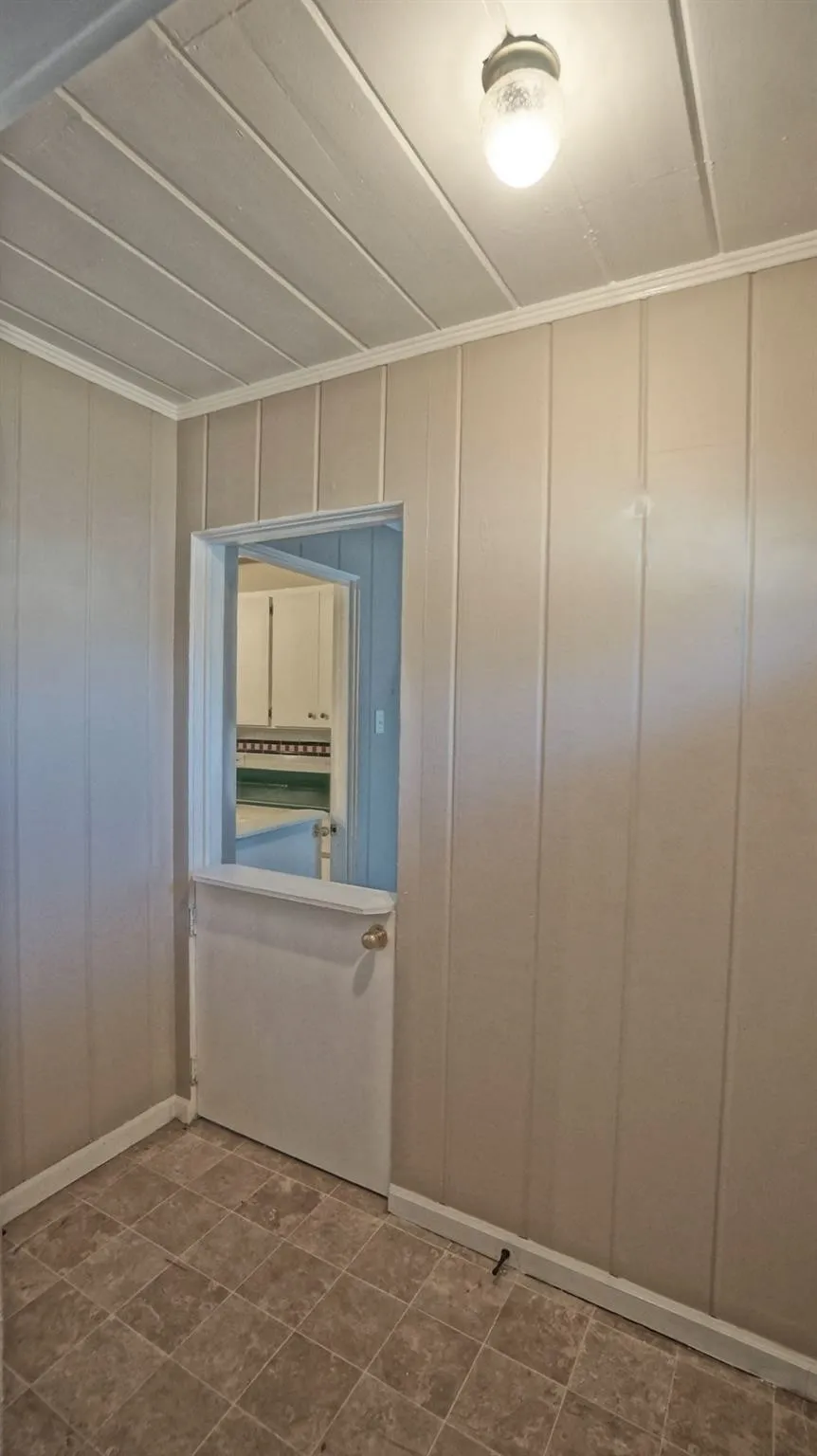 Unfurnished room featuring ornamental molding