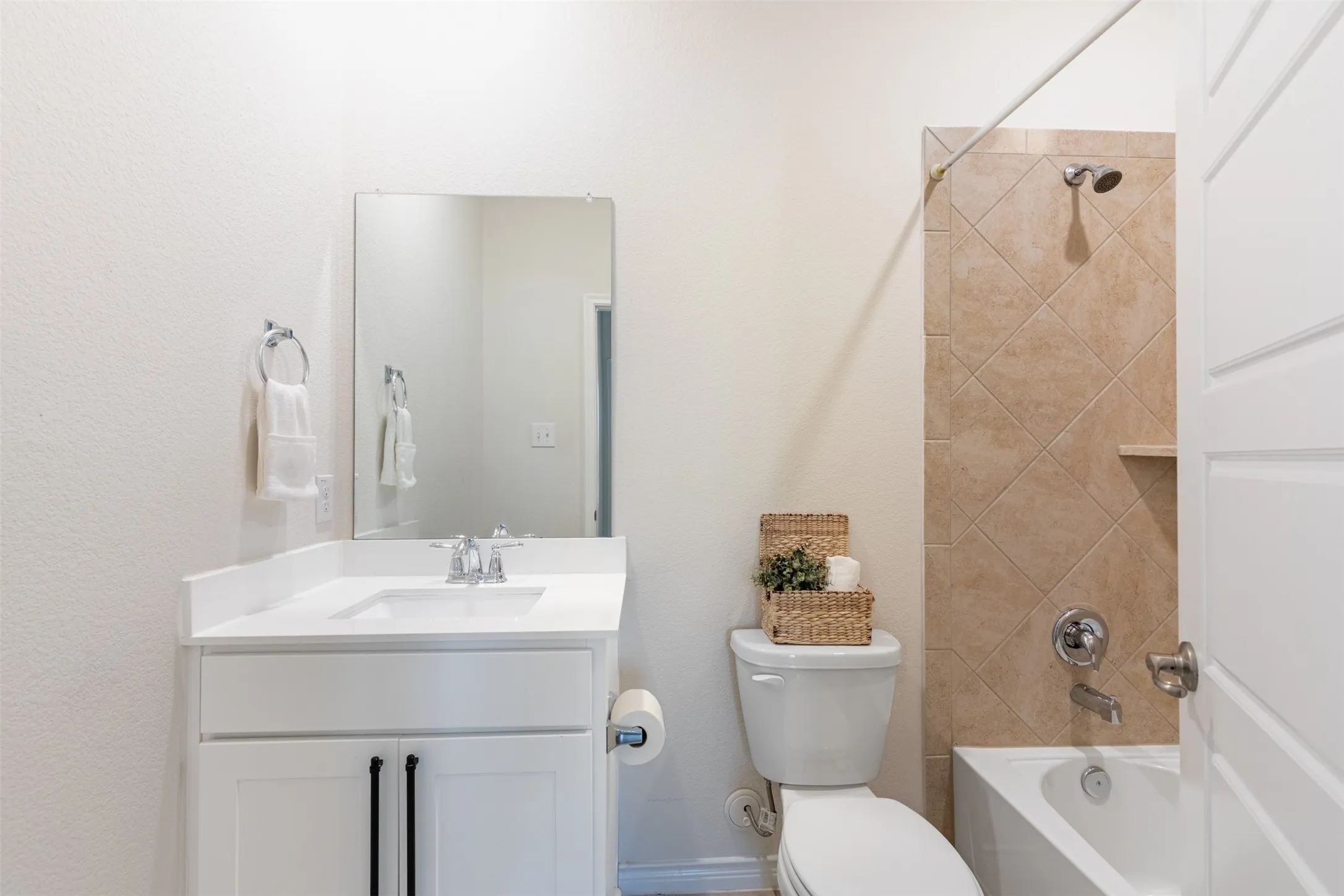 White vanity with a single basin sink, chrome faucet, and a rectangular mirror