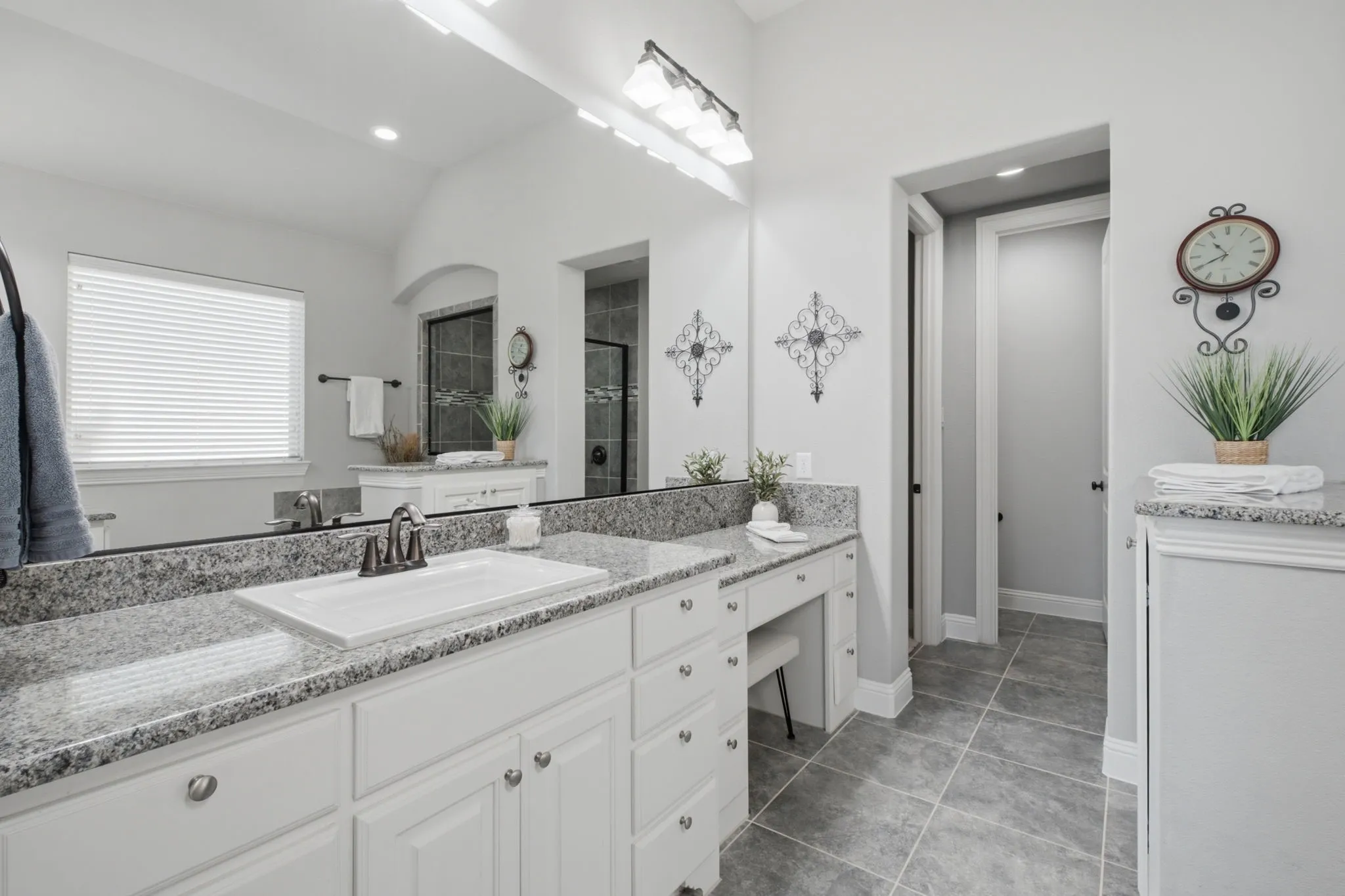 Two separate vanities, garden tub, separate walk in shower, and a huge walk in closet.
