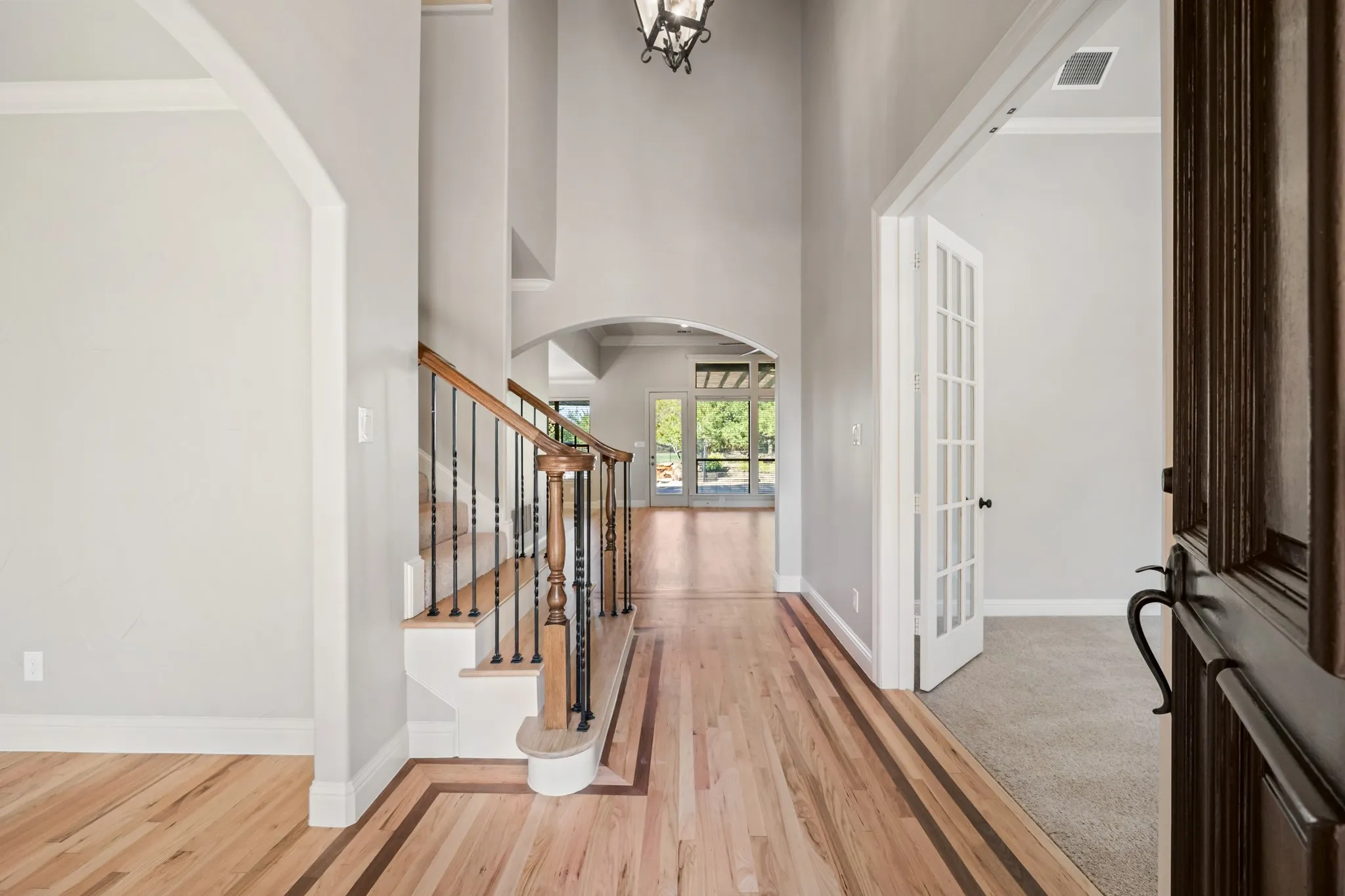 Entryway with an office to the right and formal dining to the left.