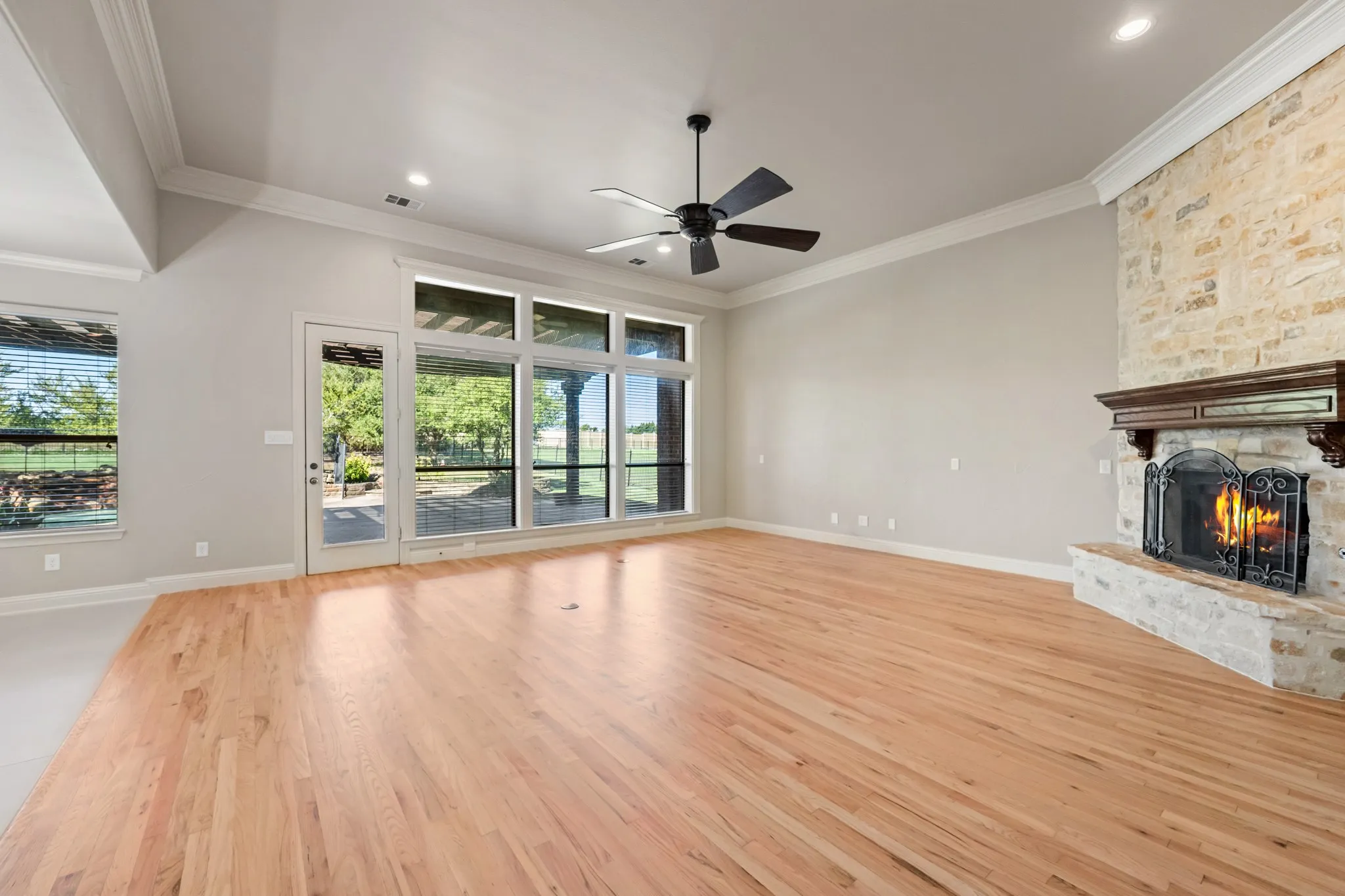 Living room features a floor to ceiling stone fireplace with gas starter and gas logs.