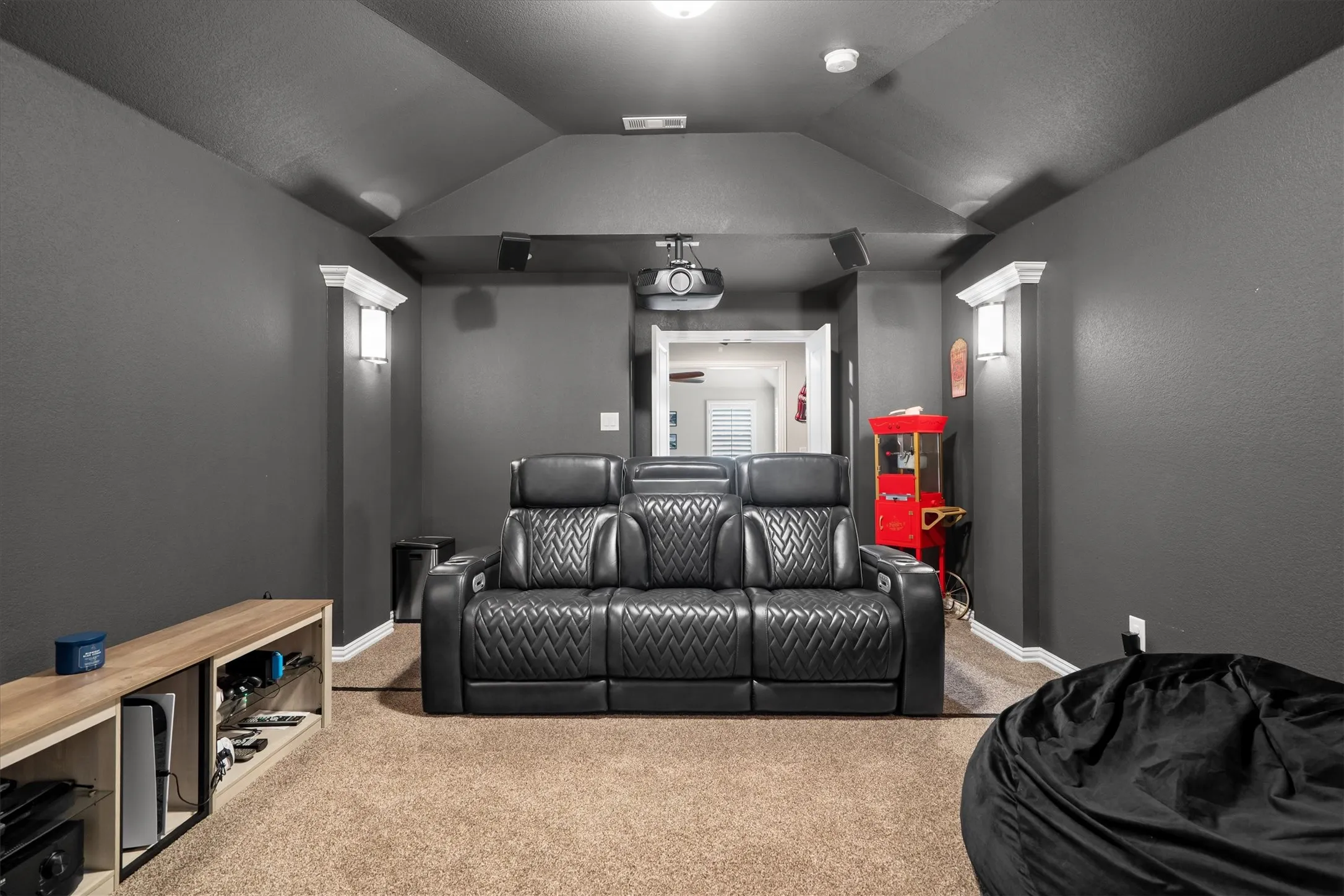  Leather reclining theater seats and a projector complete this dedicated cinema experience.