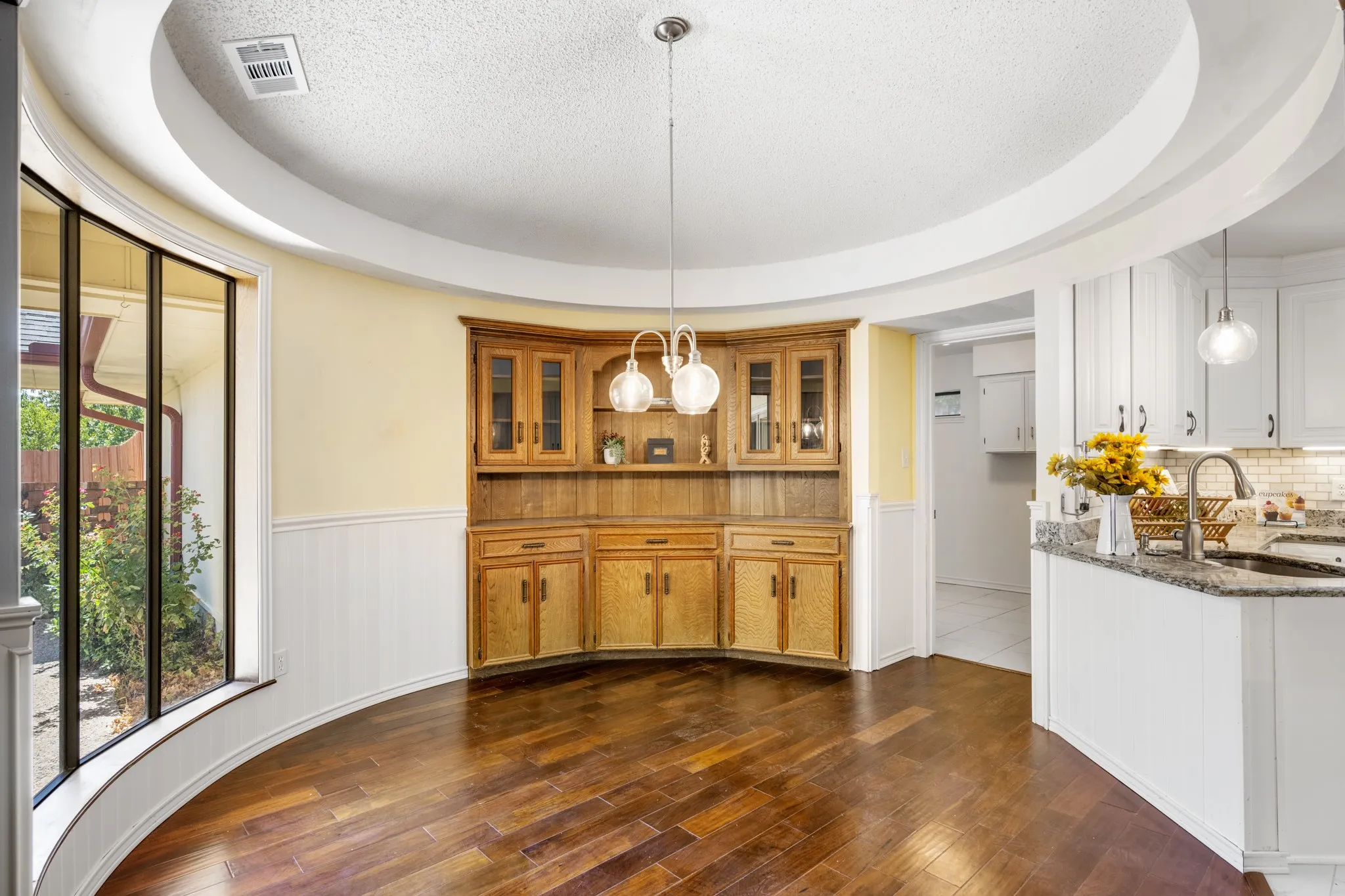 The windows flood the breakfast nook with natural light.