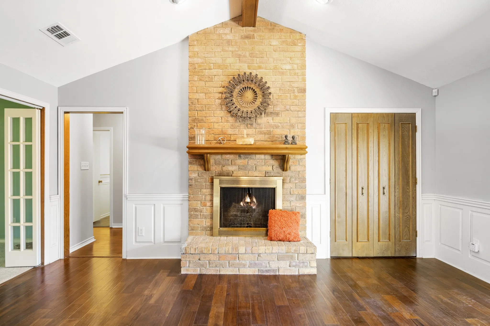 The floor to ceiling brick fireplace is a focal point in the living room adding to the warming environment.