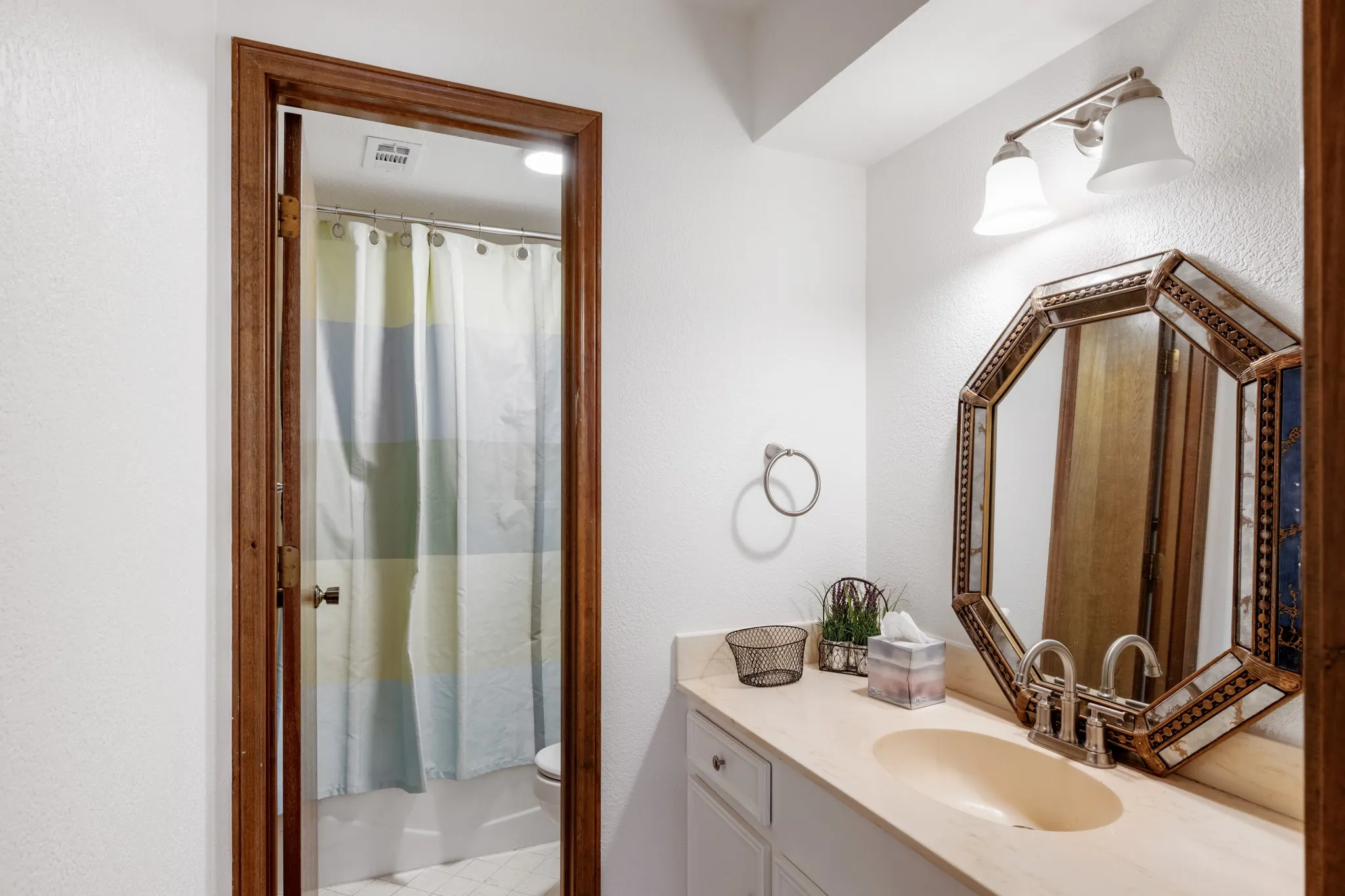Secondary bathroom with built in storage.
