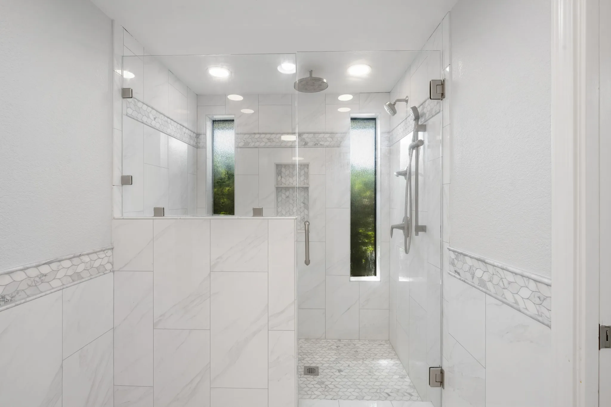 Stunning walk in shower with natural light.