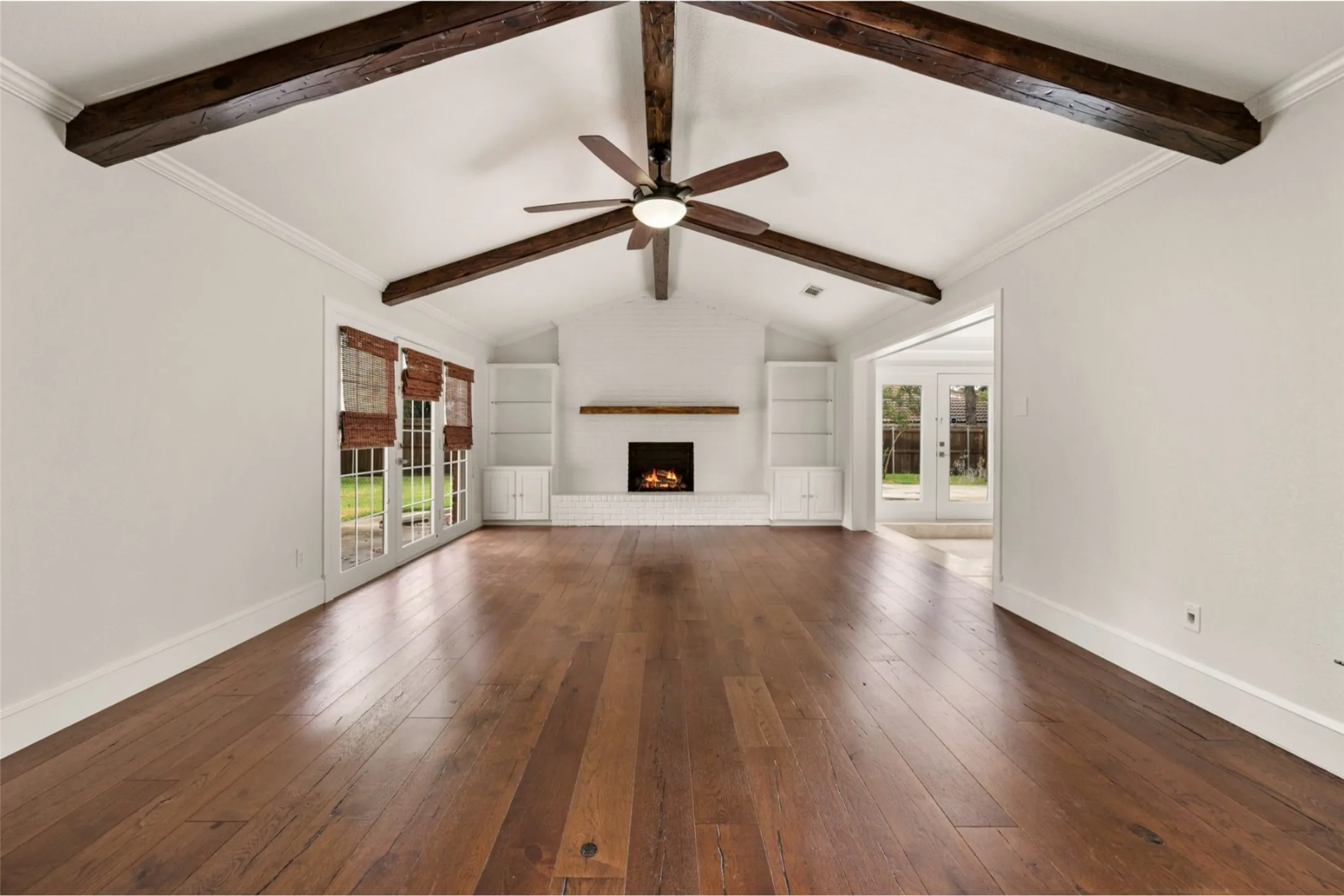 Vaulted living room with fireplace