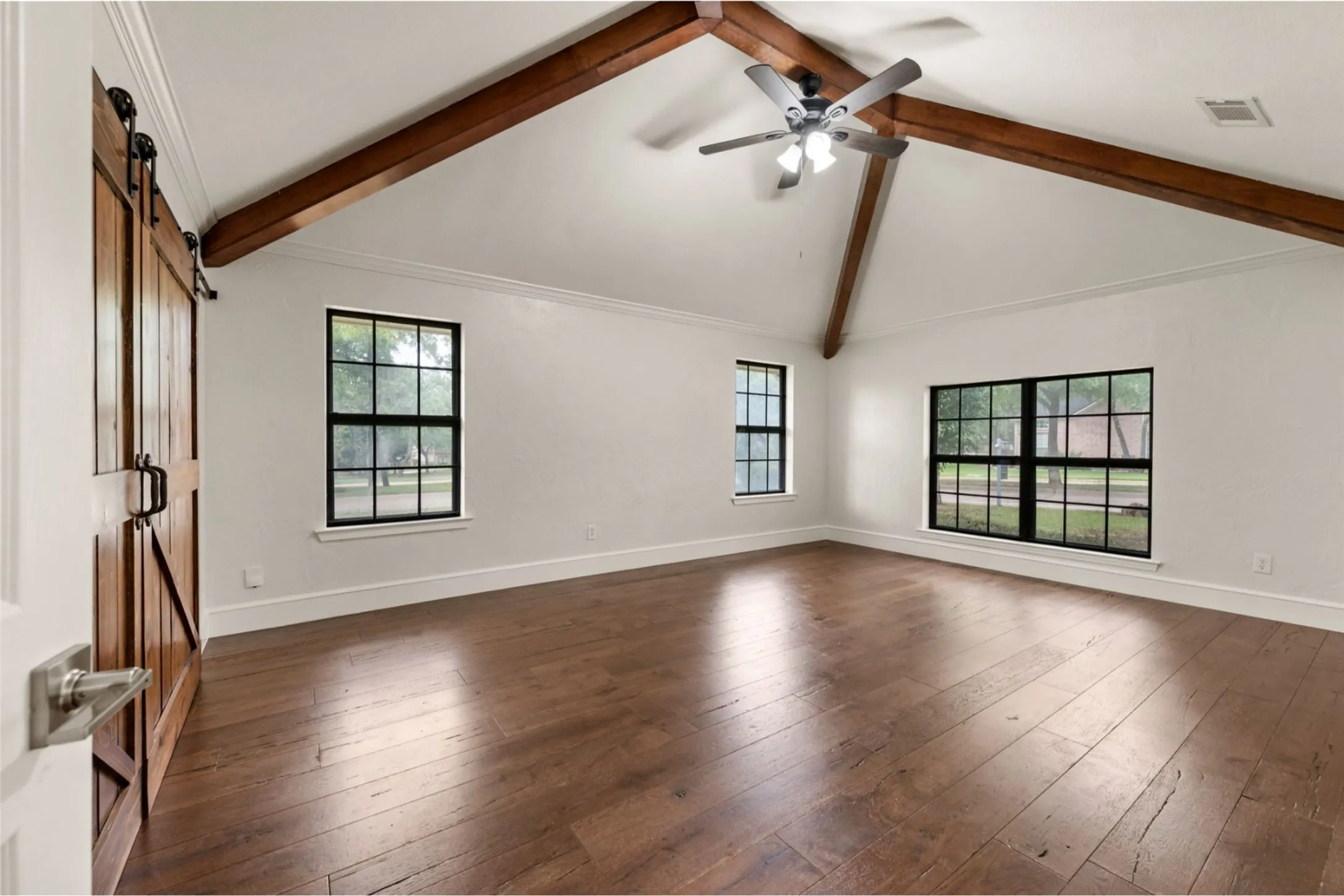Bright bedroom or flex space with vaulted ceilings