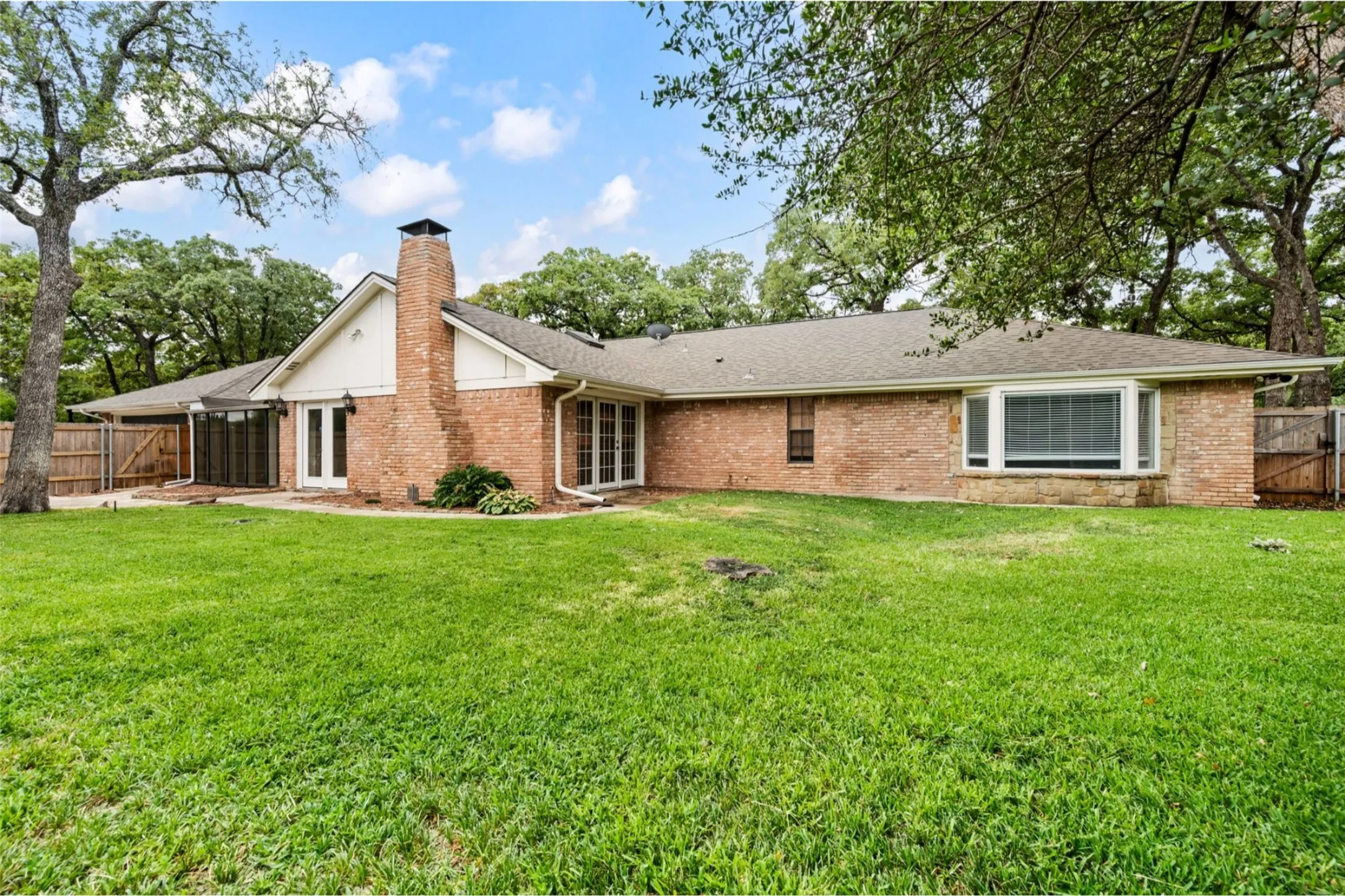 Expansive yard with mature trees