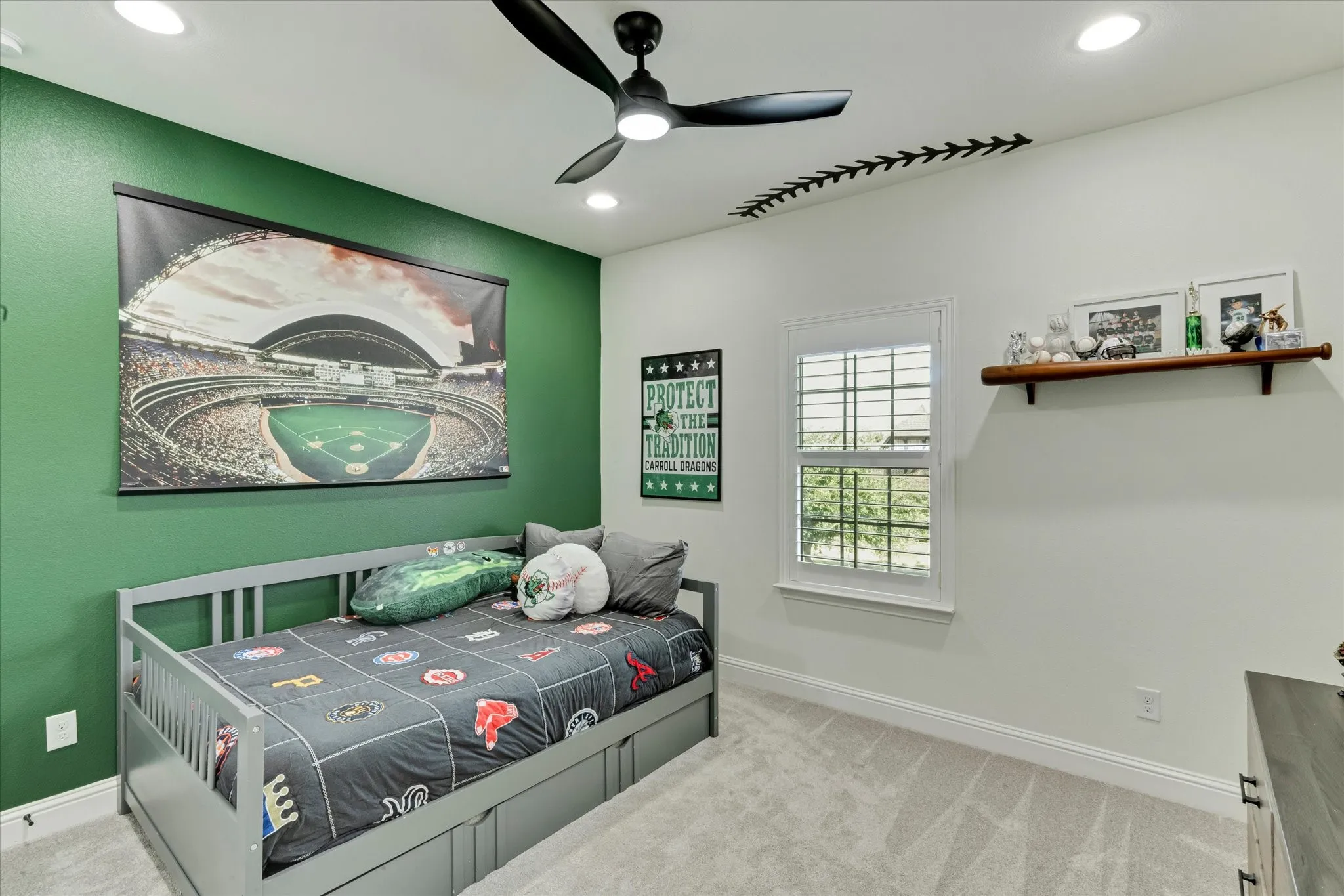 Recessed lighting illuminates this room featuring a window with plantation shutters, a ceiling fan, and carpeted flooring