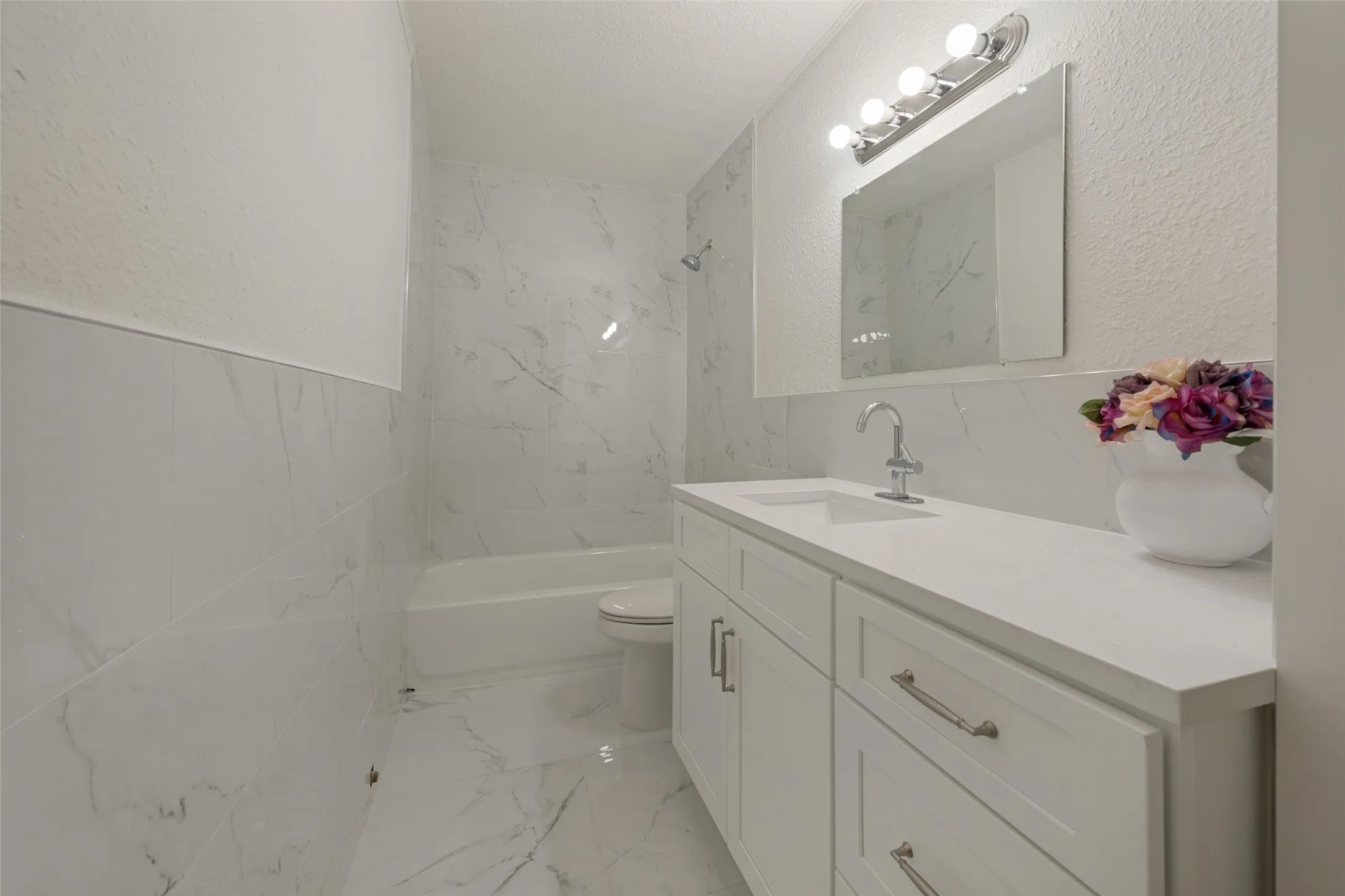 White wall tiling with subtle grey veining