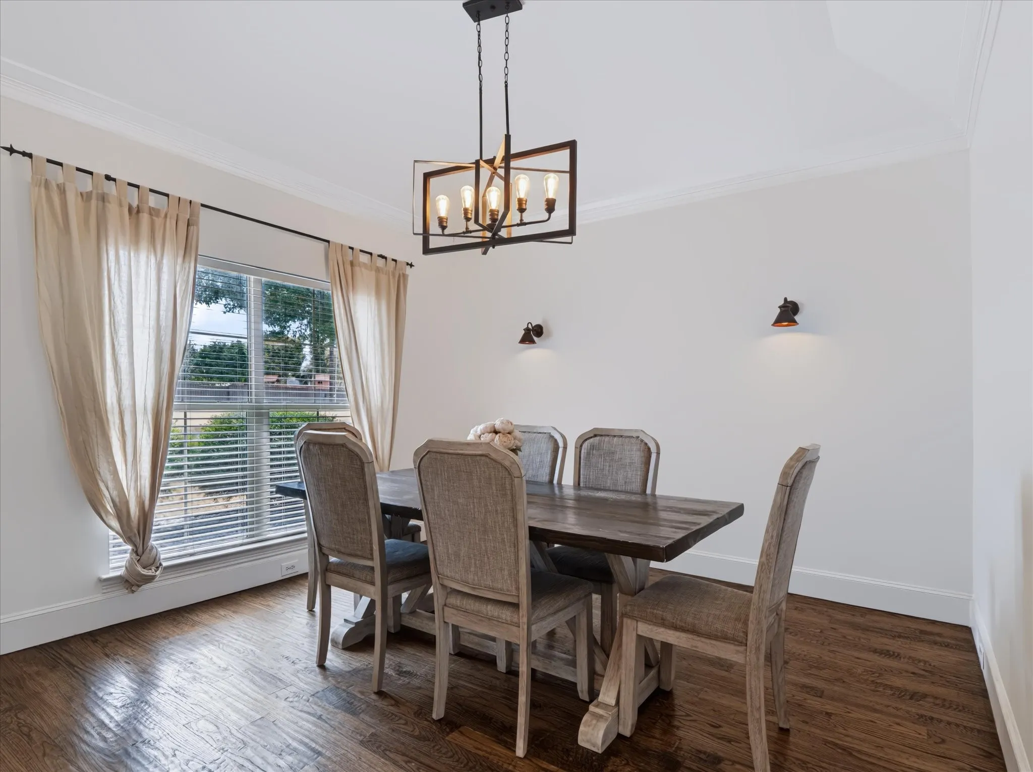 Wood-finish flooring with crisp white baseboards