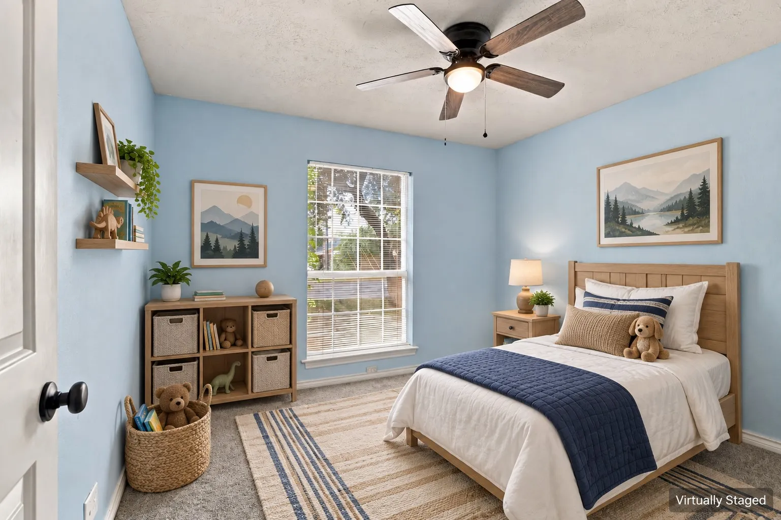 Light blue painted walls, ceiling fan with integrated lighting, wood-frame window, and wood-finish door with black hardware