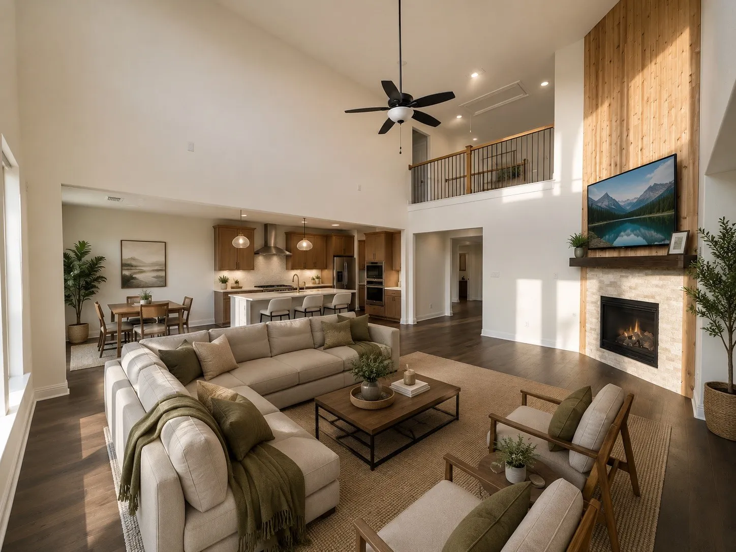 Open-concept living space featuring vaulted ceilings, wood-finish flooring, a stone-clad fireplace with a wood mantel, and a kitchen with an island and pendant lighting