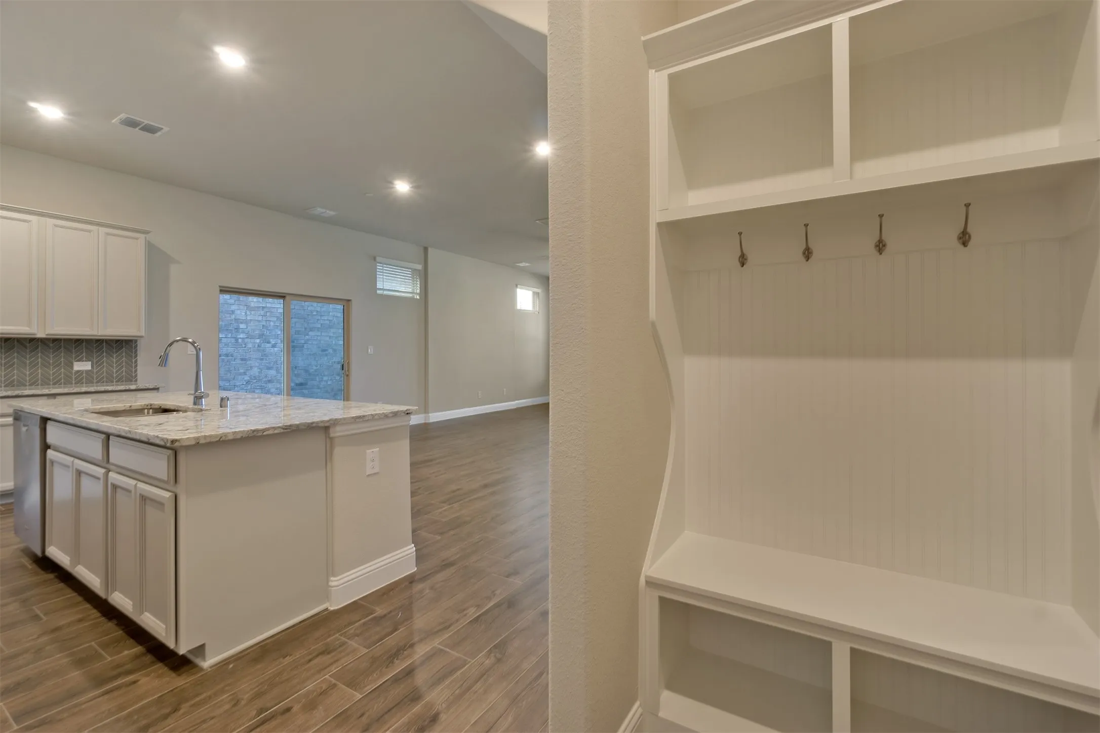 Built in drop off area is conveniently located near garage