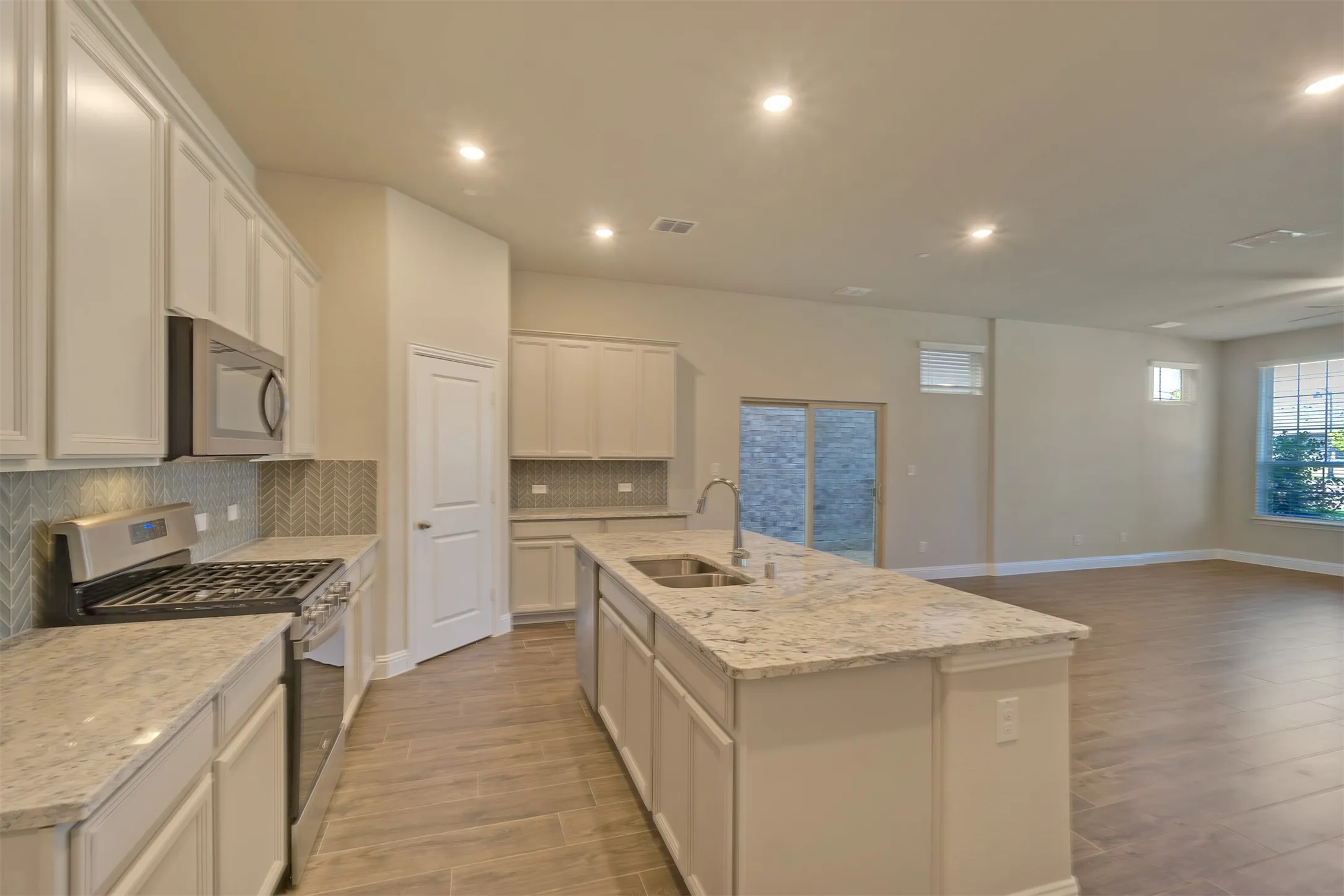 Beautiful and functional kitchen opens onto dining area and family room