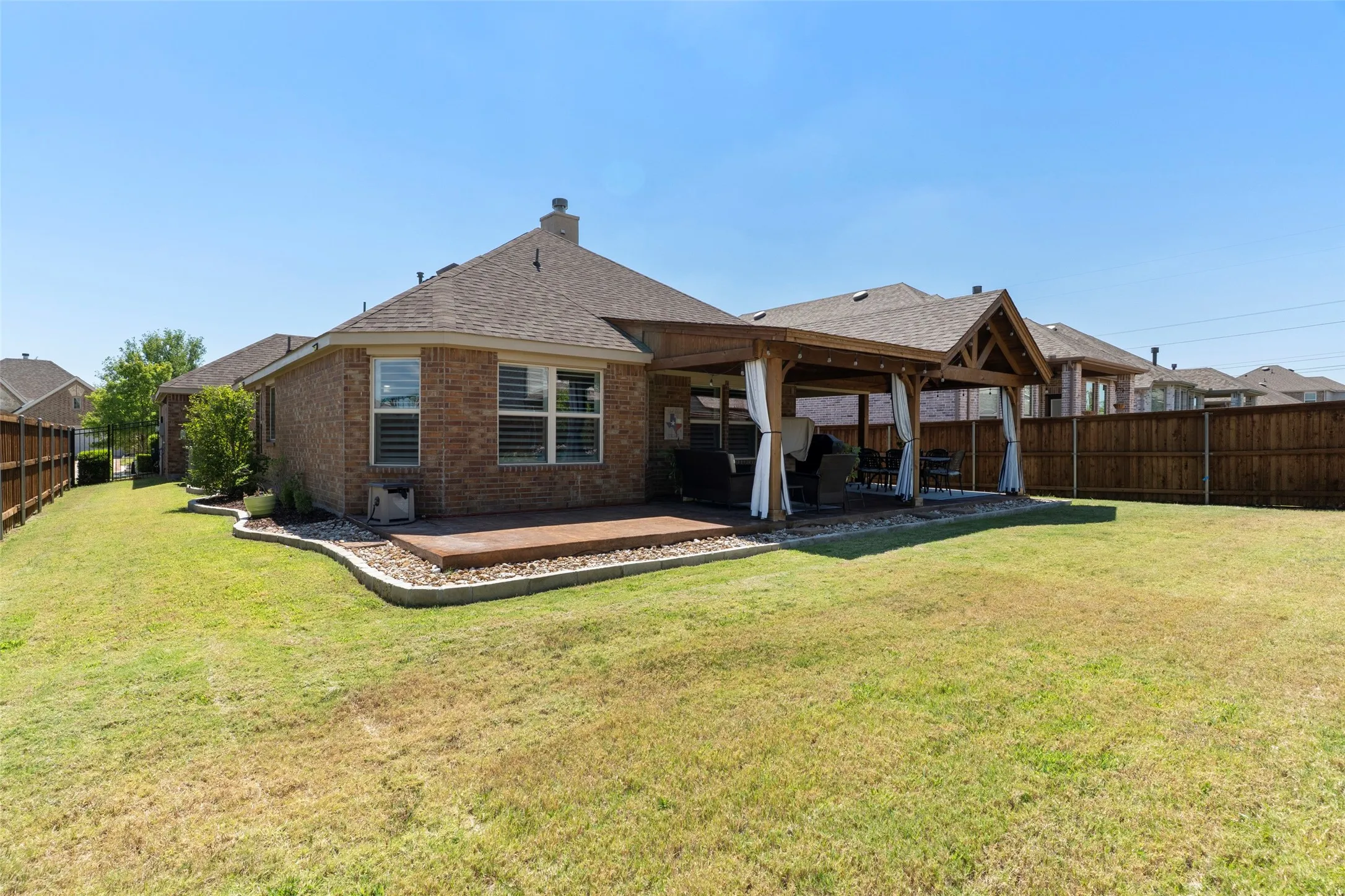 Large grassy backyard with oversized Patio!