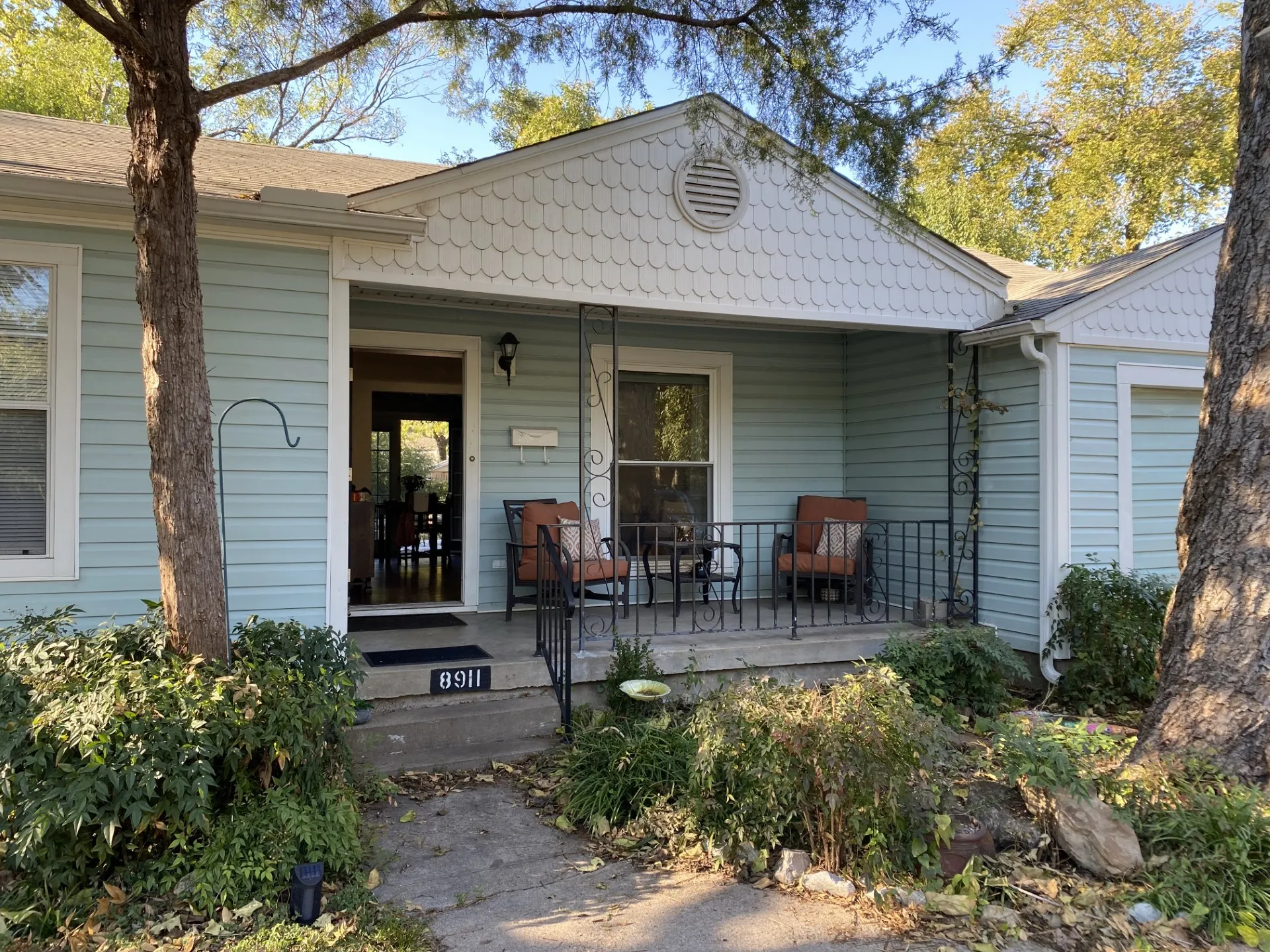 Light blue siding exterior with a covered front porch