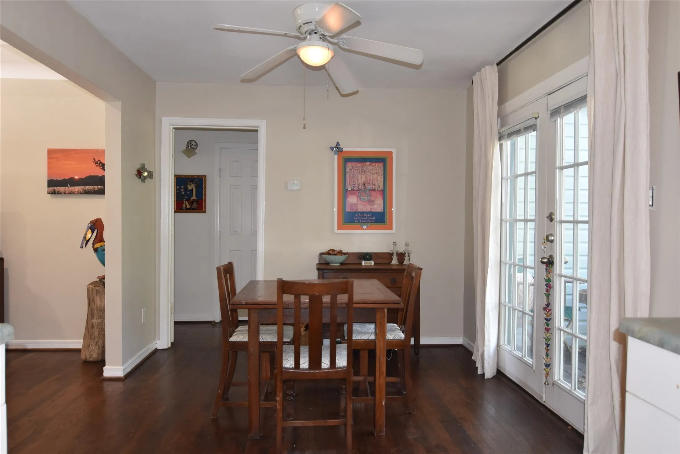 Dark wood-finish flooring with white trim