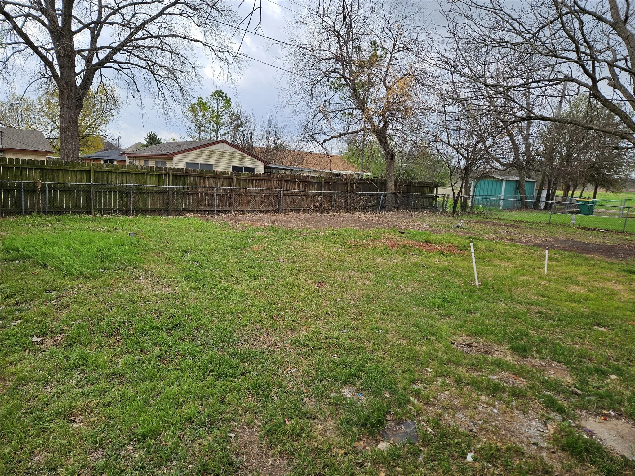 View of fenced backyard