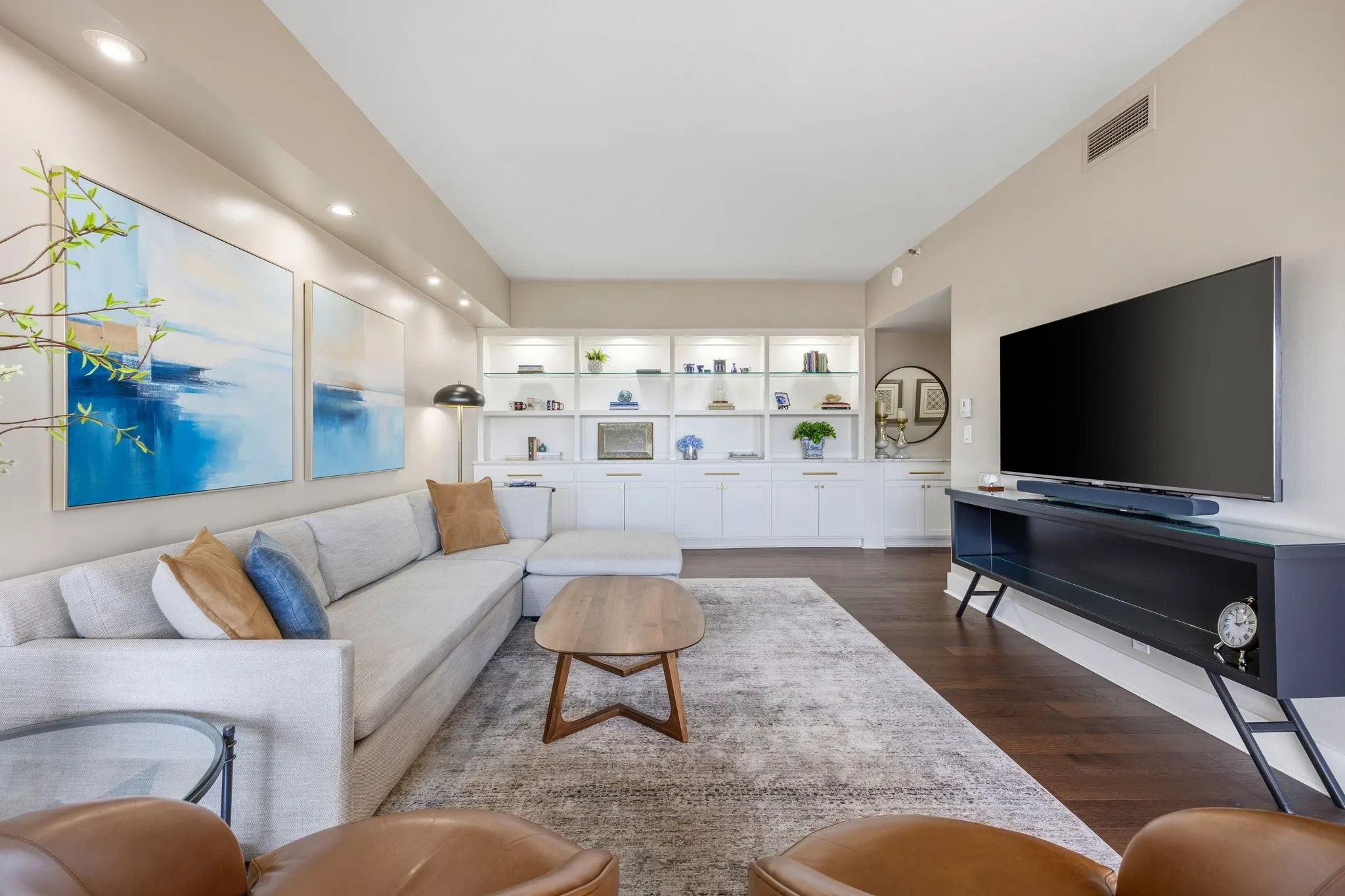 That wall of built-ins is EVERYTHING! Offering abundant storage and display shelving, it’s the perfect place to showcase your favorite décor, artwork, and personal treasures.
