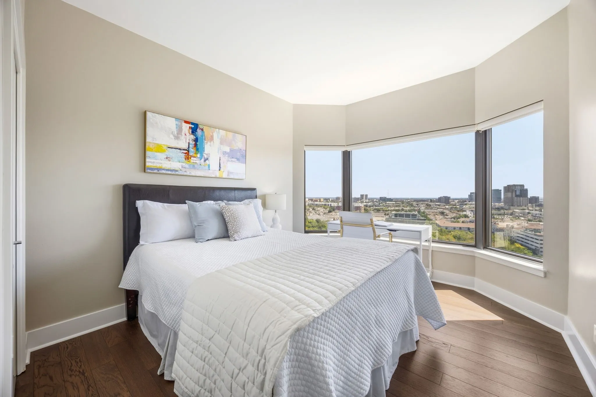 The guest bedroom’s spacious bay window area offers the flexibility to create a cozy sitting area or a convenient workspace for those work-from-home days.