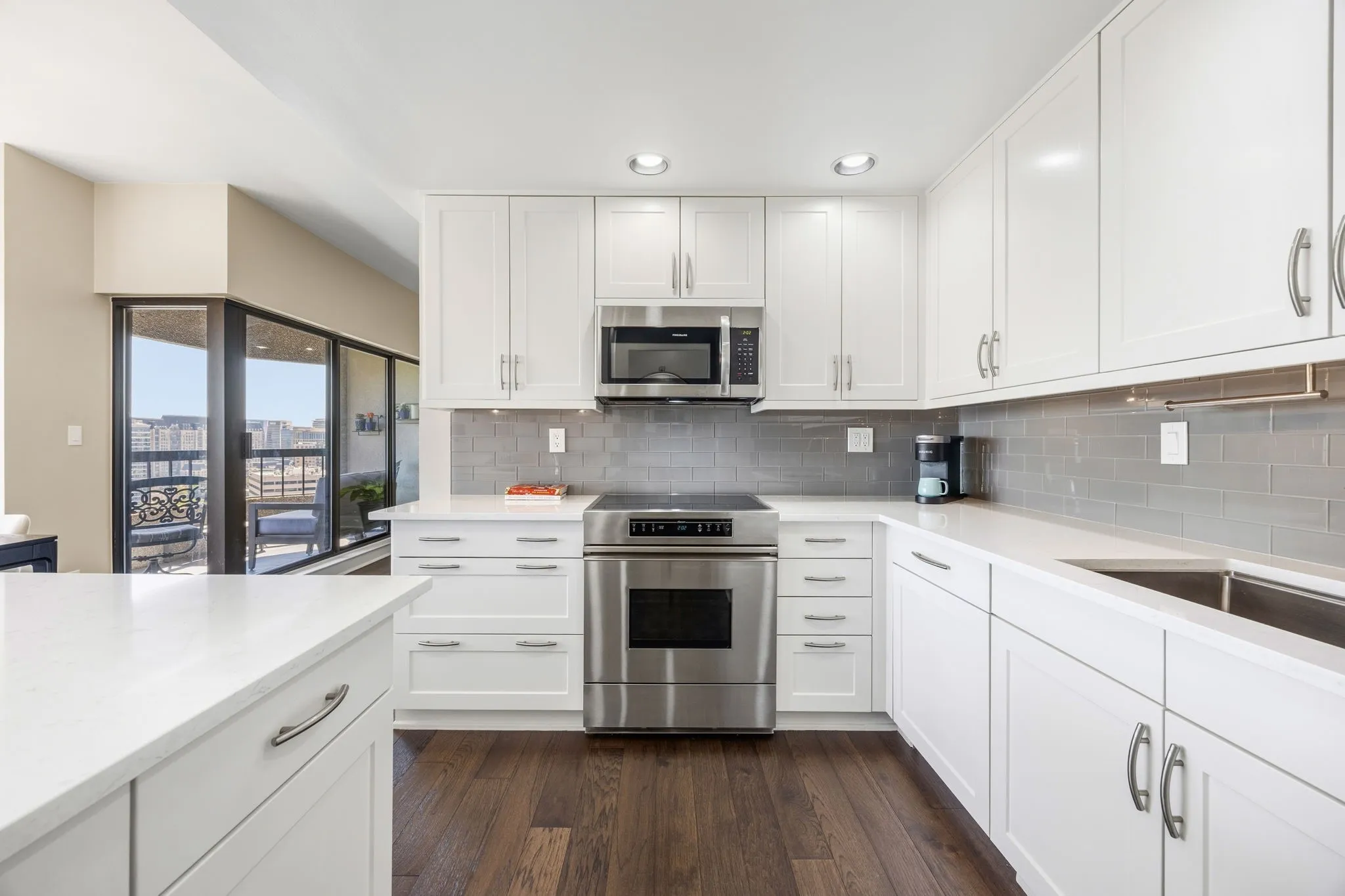 Who doesn’t love a light and bright kitchen? This beautifully updated space features crisp new cabinetry, stainless steel appliances, recessed lighting, and a large single-bowl sink, creating a fresh and inviting setting for everyday living and entertaining.