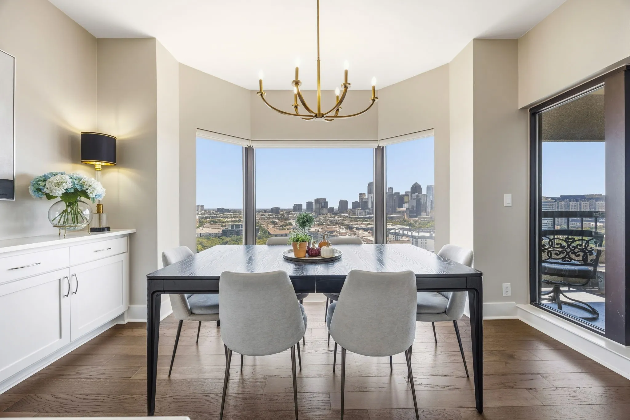 Dining with the Dallas skyline as your backdrop! The wall of built-ins adds valuable storage and display space while providing convenient serving options for entertaining.