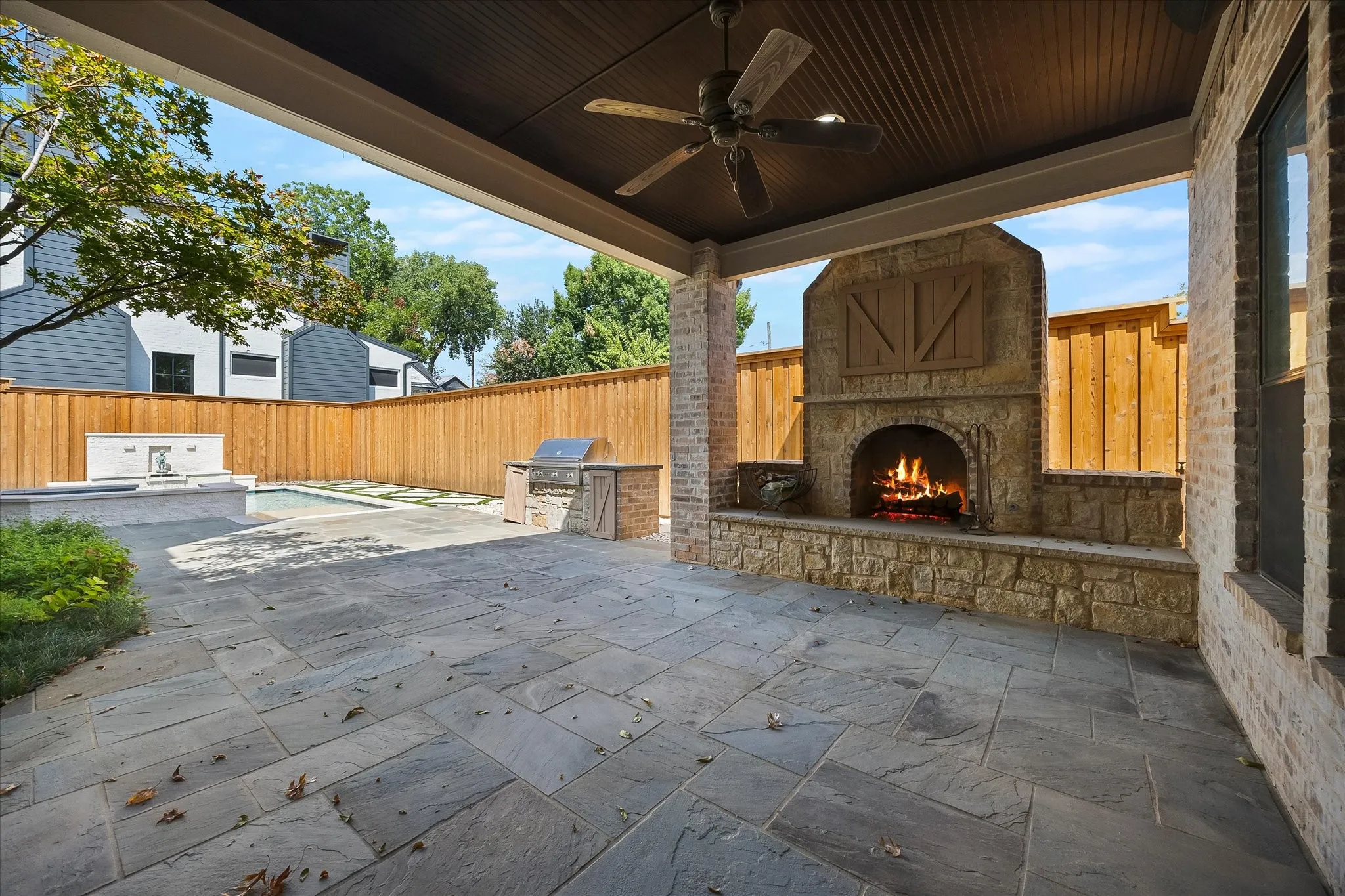 Covered patio with stone paver flooring