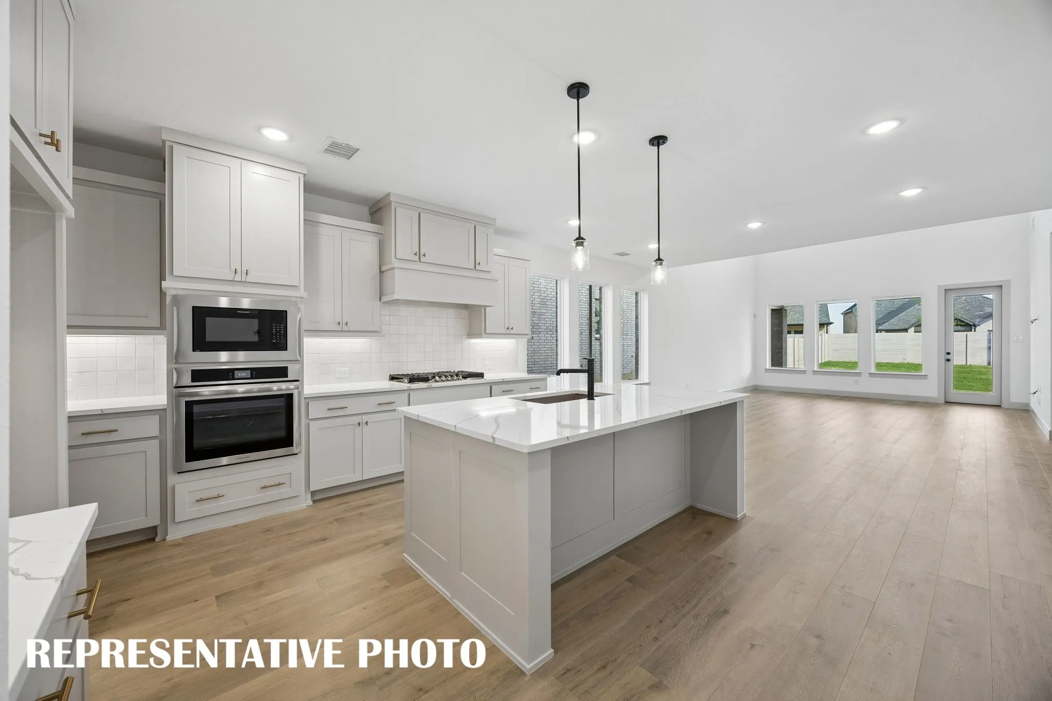 The spacious kitchen island is this centerpiece of this chefs kitchen and the perfect place for friends and family to gather round.  REPRESENTATIVE PHOTO