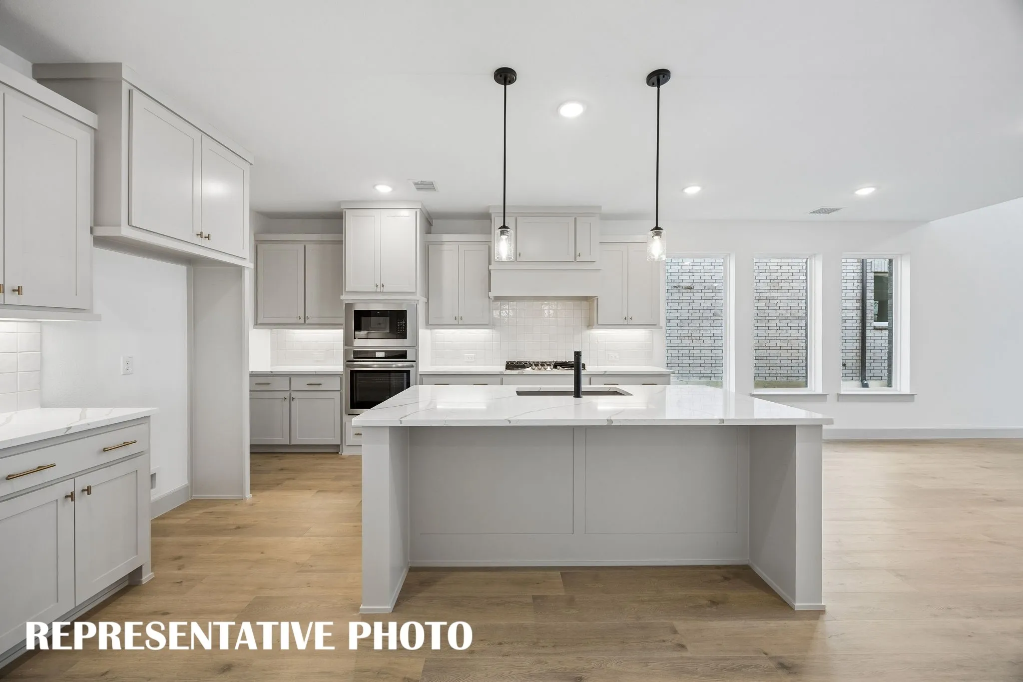 Featuring ample prep and storage space, all the chefs in the family will love this dream kitchen!  REPRESENTATIVE PHOTO