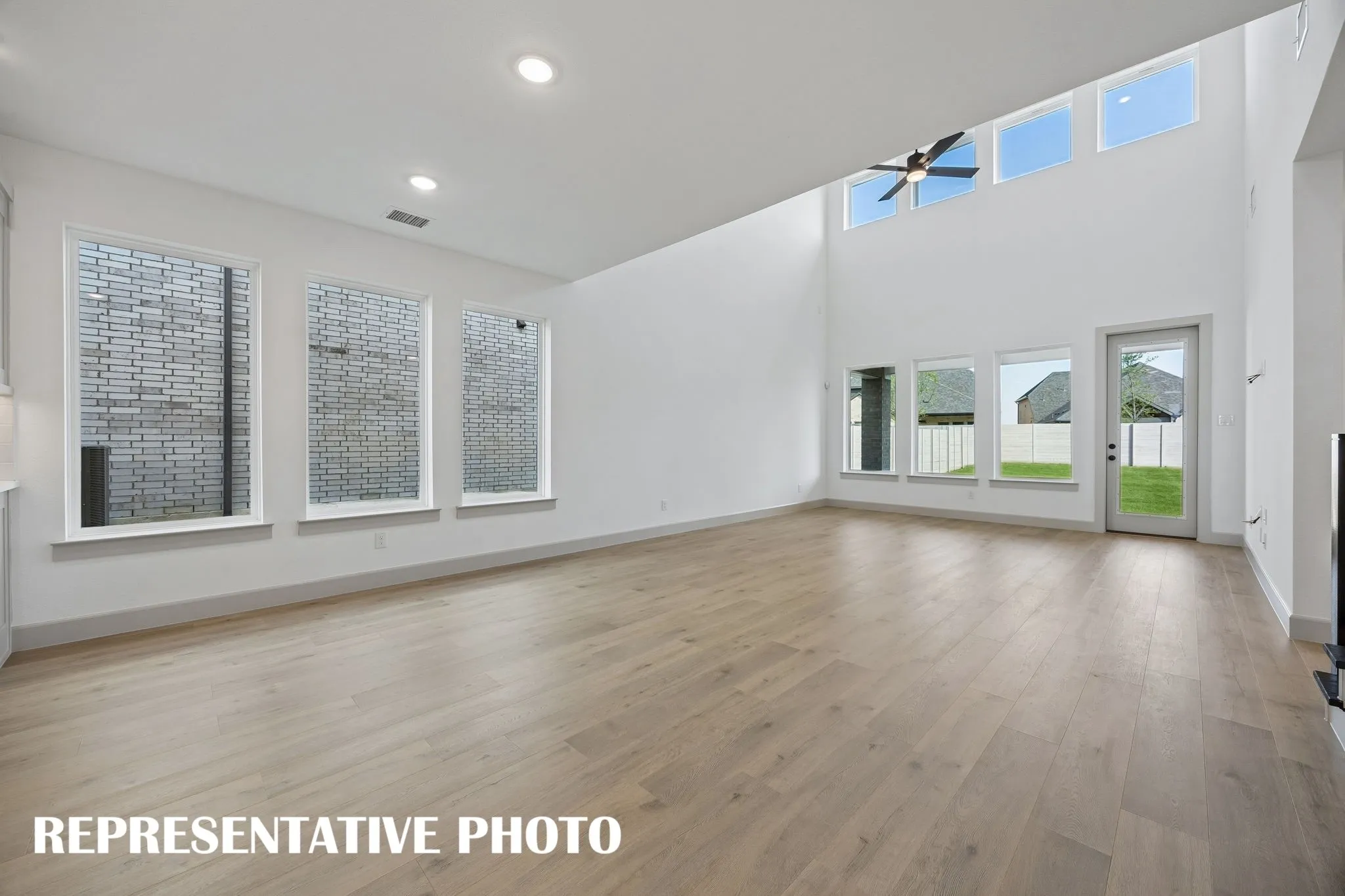 Conveniently located between the kitchen and family room, this light filled dining room is the ideal space for hosting lively dinner parties or cozy family get togethers.  REPRESENTATIVE PHOTO