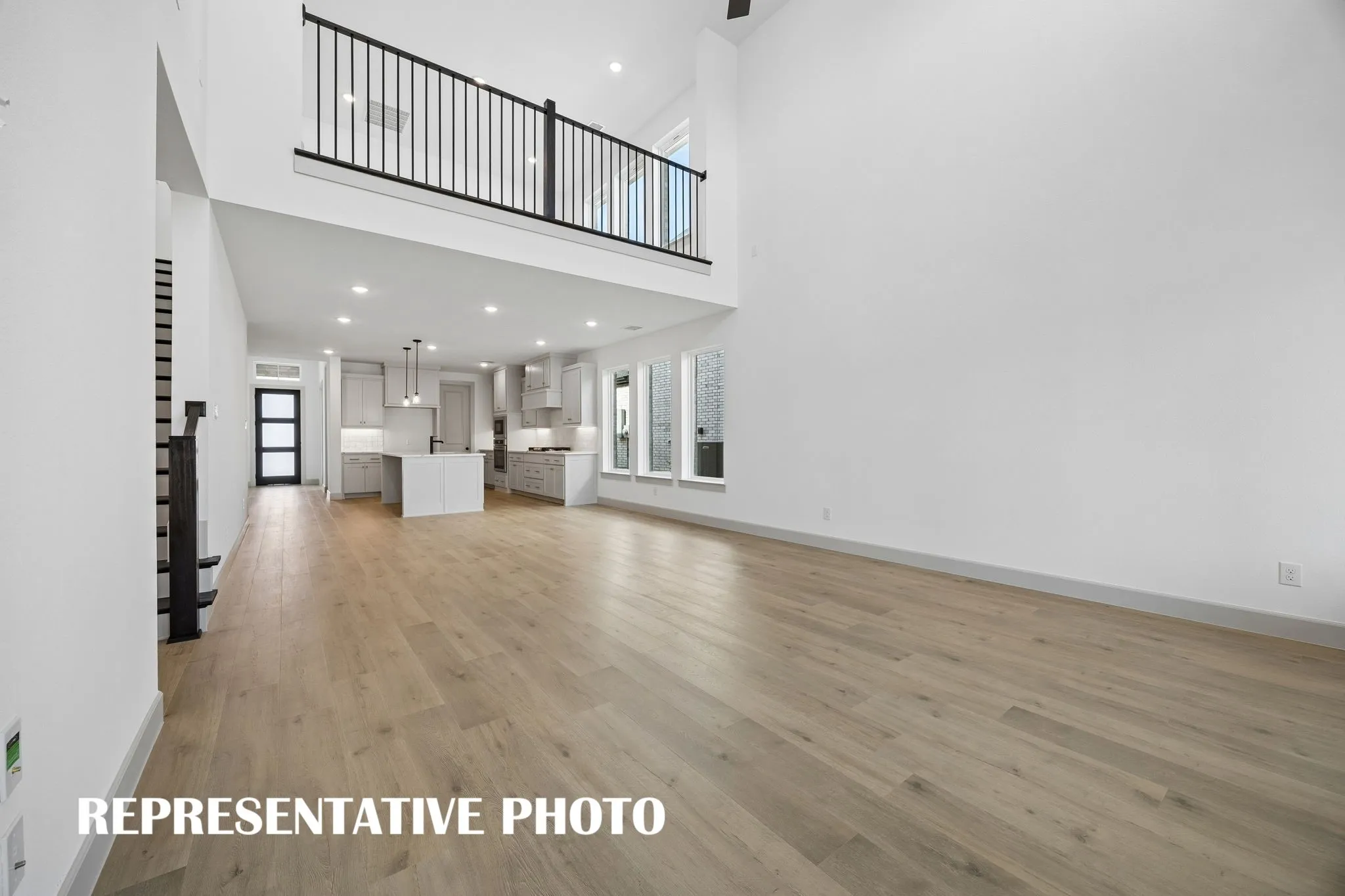 Featuring a game room open to the family room below, you'll enjoy dual level entertaining in our wonderful Orleans II plan.  REPRESENTATIVE PHOTO