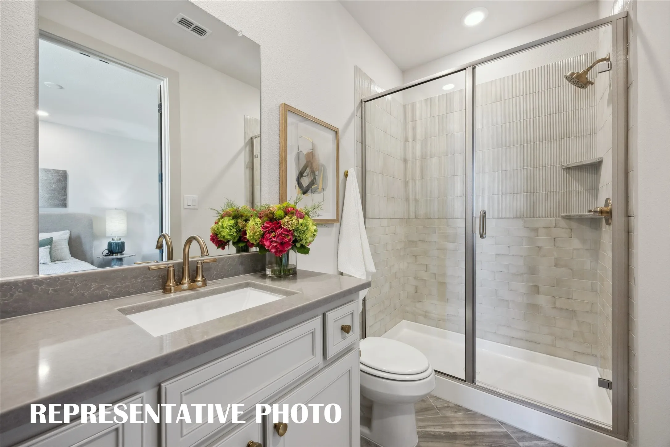 Your guests will never want to leave the beautiful and spacious guest baths in our Sophie plan!  REPRESENTATIVE PHOTO