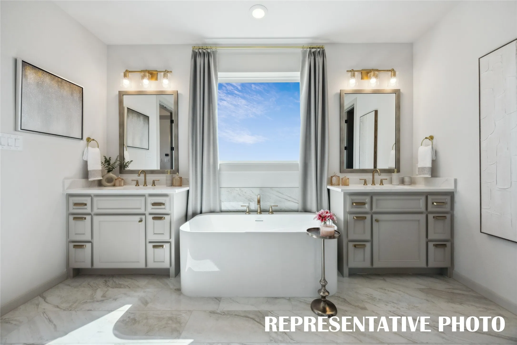 Filled with style and offering plenty of room for two, this owner's bath is the perfect place to start or end your day!  REPRESENTATIVE PHOTO