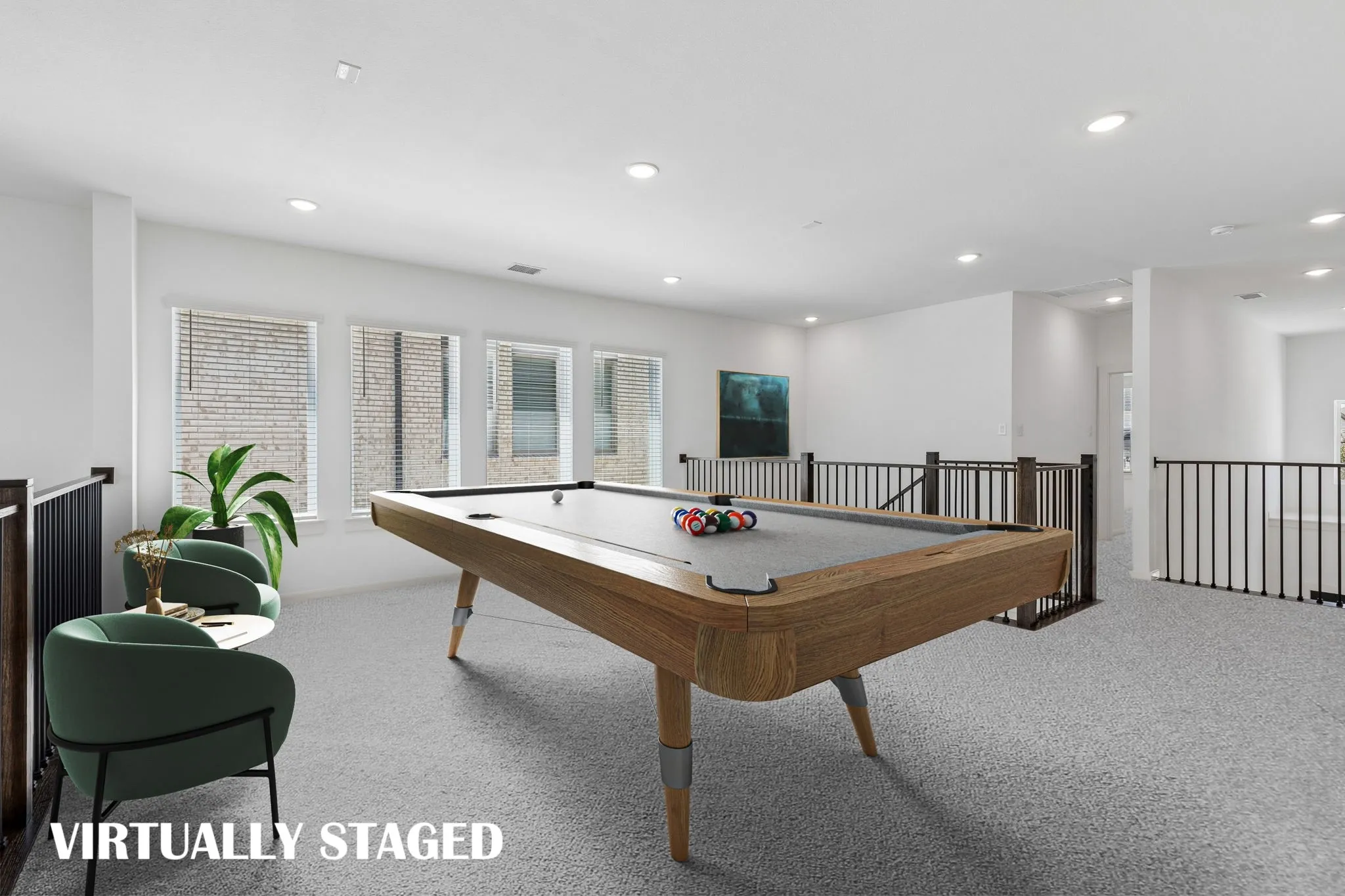 Spacious and bright, this game room offers endless family fun time!  VIRTUALLY STAGED