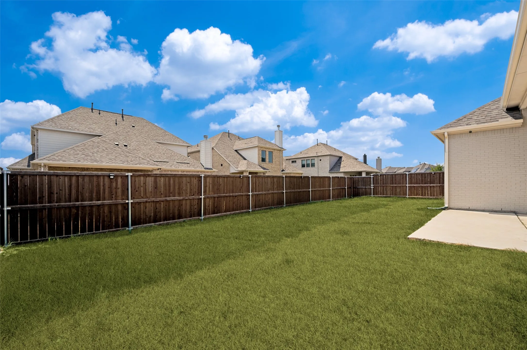 The expansive, fully fenced backyard offers plenty of open green space for outdoor activities, pets, entertaining, or creating your own personalized outdoor retreat. With ample room to spread out and a patio ready for seating or grilling, this backyard provides endless possibilities for enjoying outdoor living.