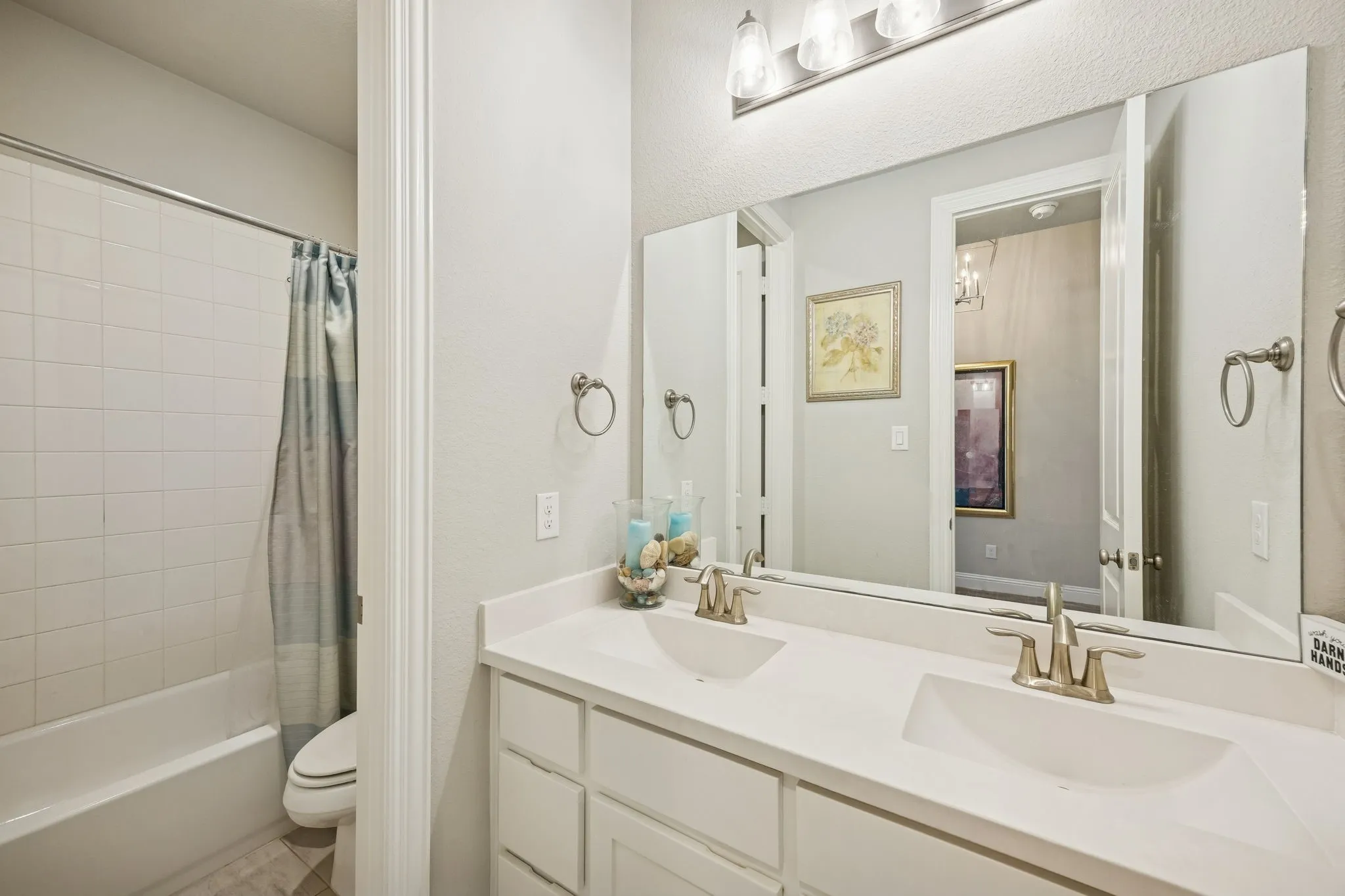 guest bathroom with shower tub combo