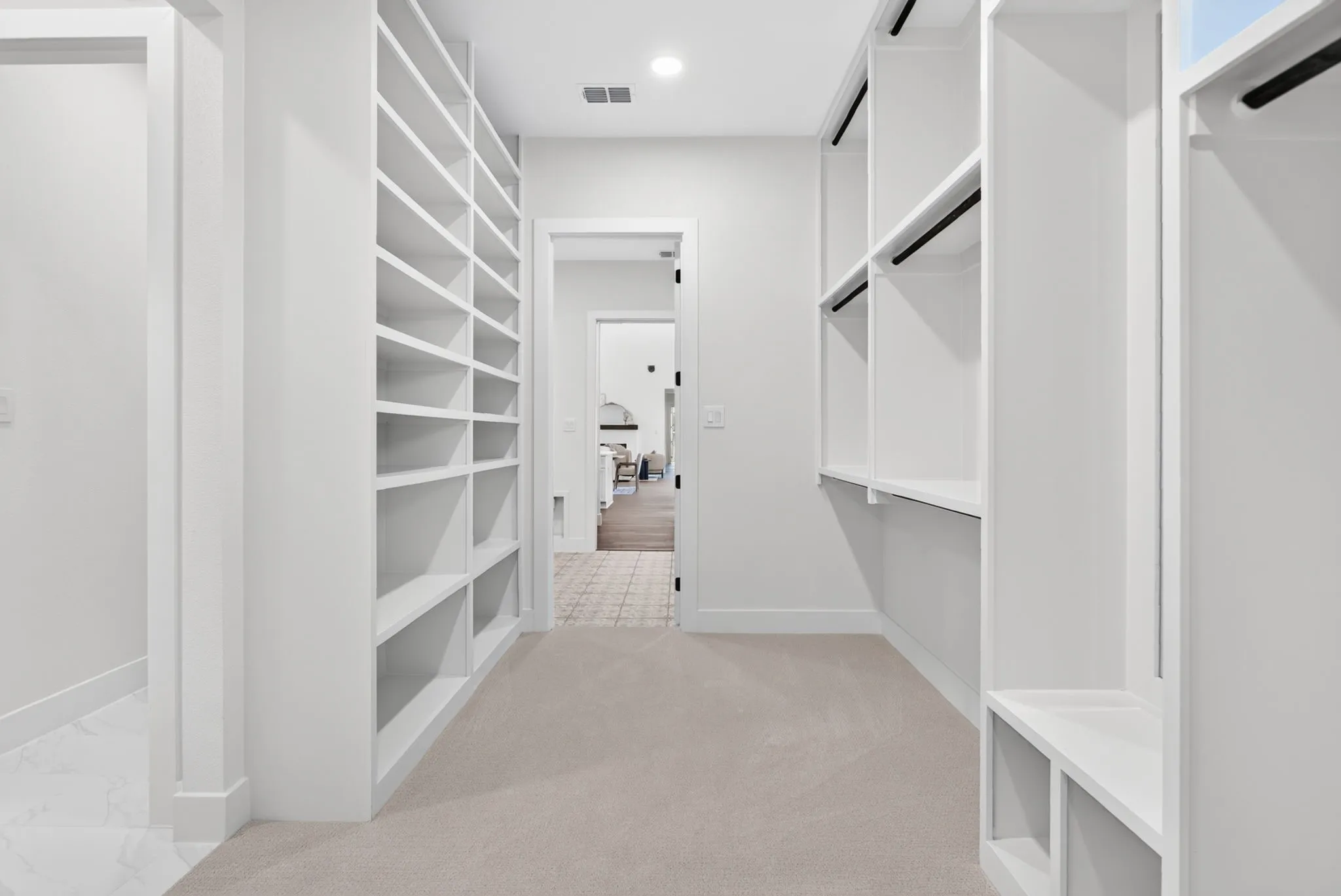 So much thoughtful storage - plus a built-in full length mirror, and it all connects to the laundry room.