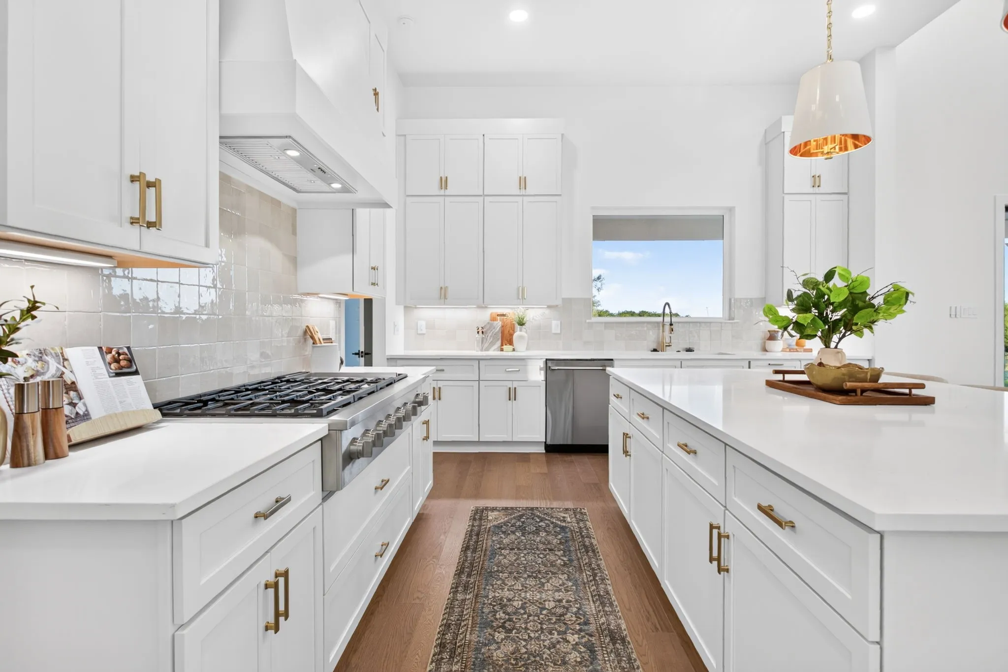 Level 6 Calacatta Adonia Quartz counters; GE Cafe appliance package with 48" gas stove. SWOON!