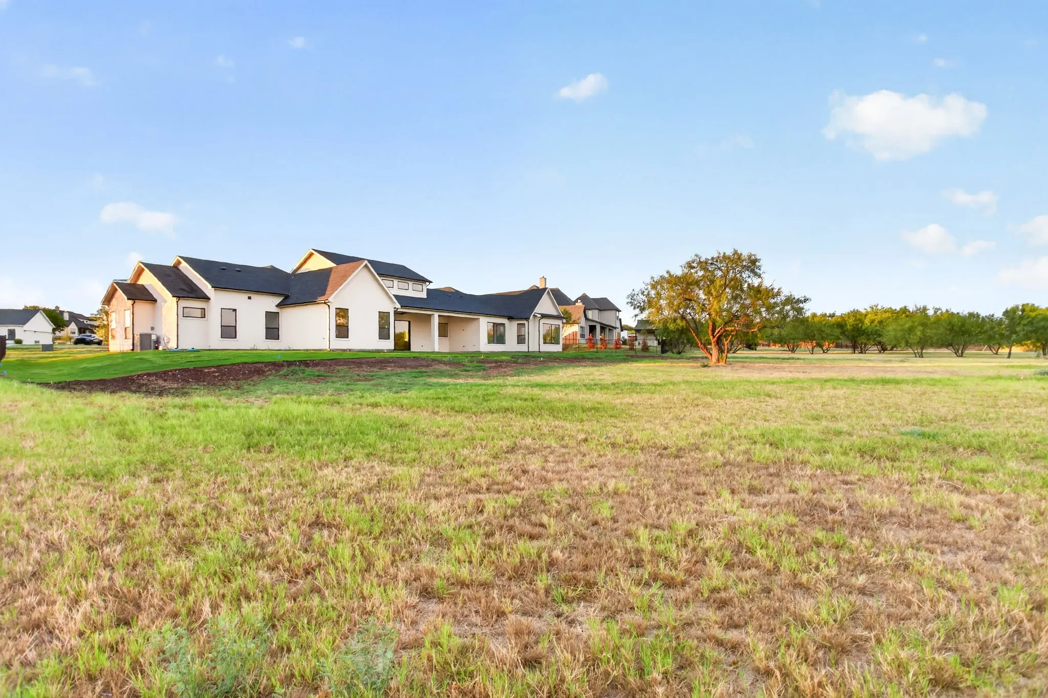Spacious lot with so much room for future dreams: a guest home (they're allowed), a pool, a workshop, a garden, a play space...
