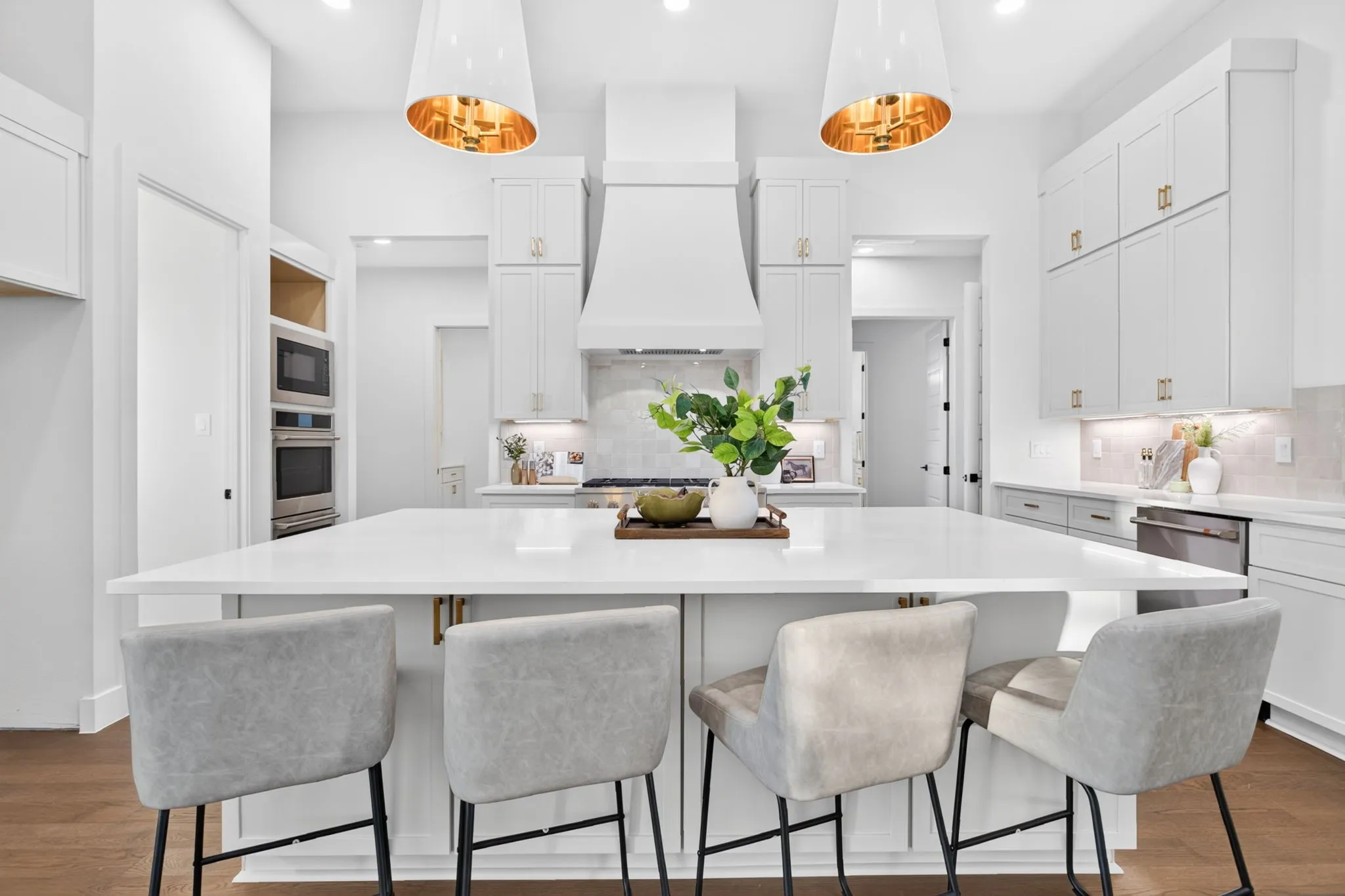 Huge island with tons of storage; custom lighting; incredible cabinetry package.