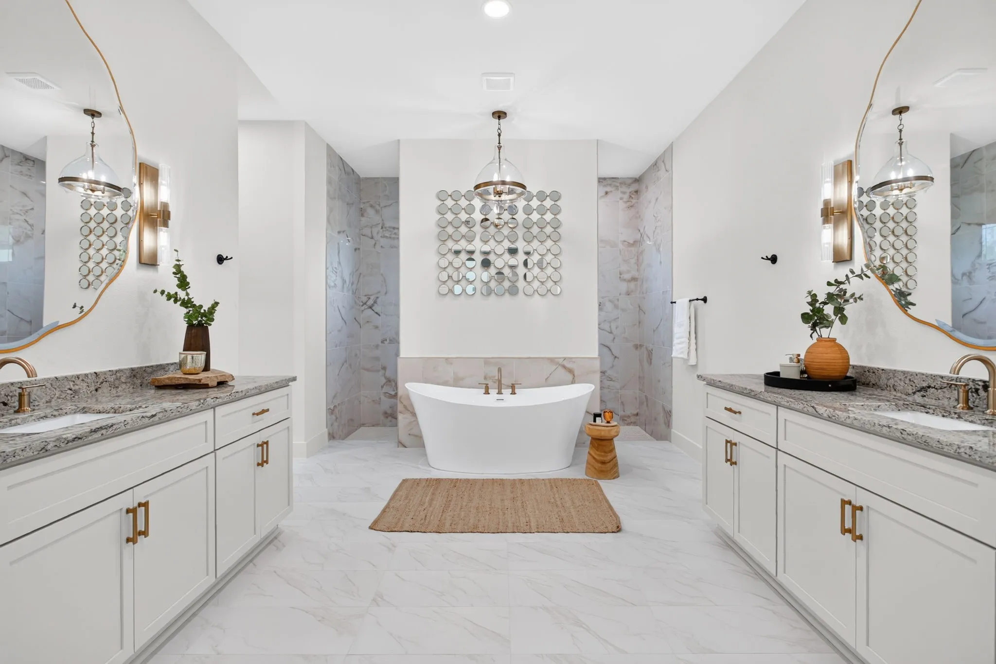 And then imagine getting ready for your day in this luxury space. Dedicated linen closet, separate vanities with custom mirrors and lighting. Stand-alone tub. Soft, soothing colors.