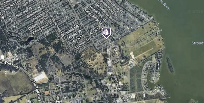 Map Image. Depicting a satellite view of a residential and natural landscape, including waterways and street layouts