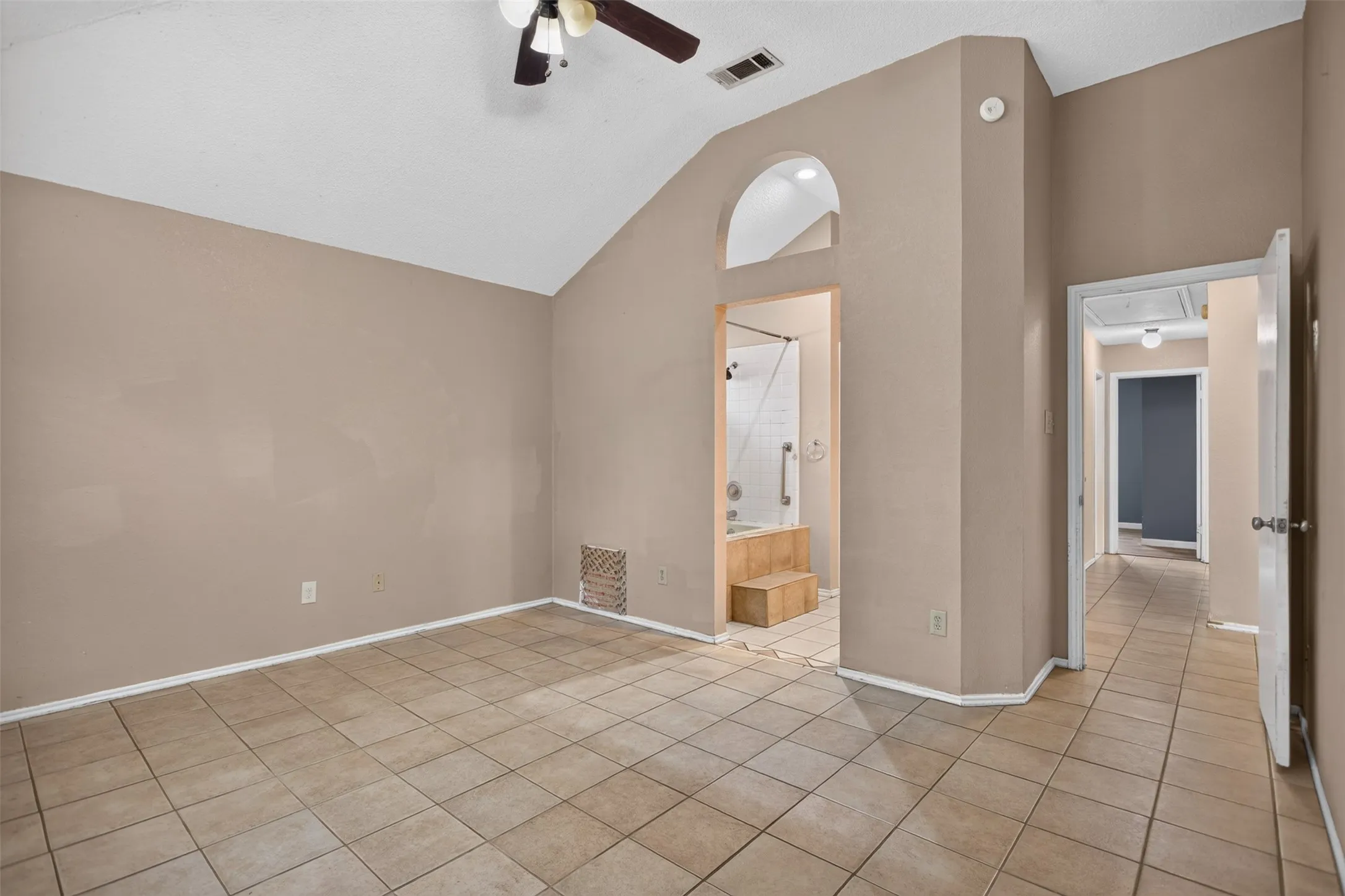 High ceilings continue in the primary suite.