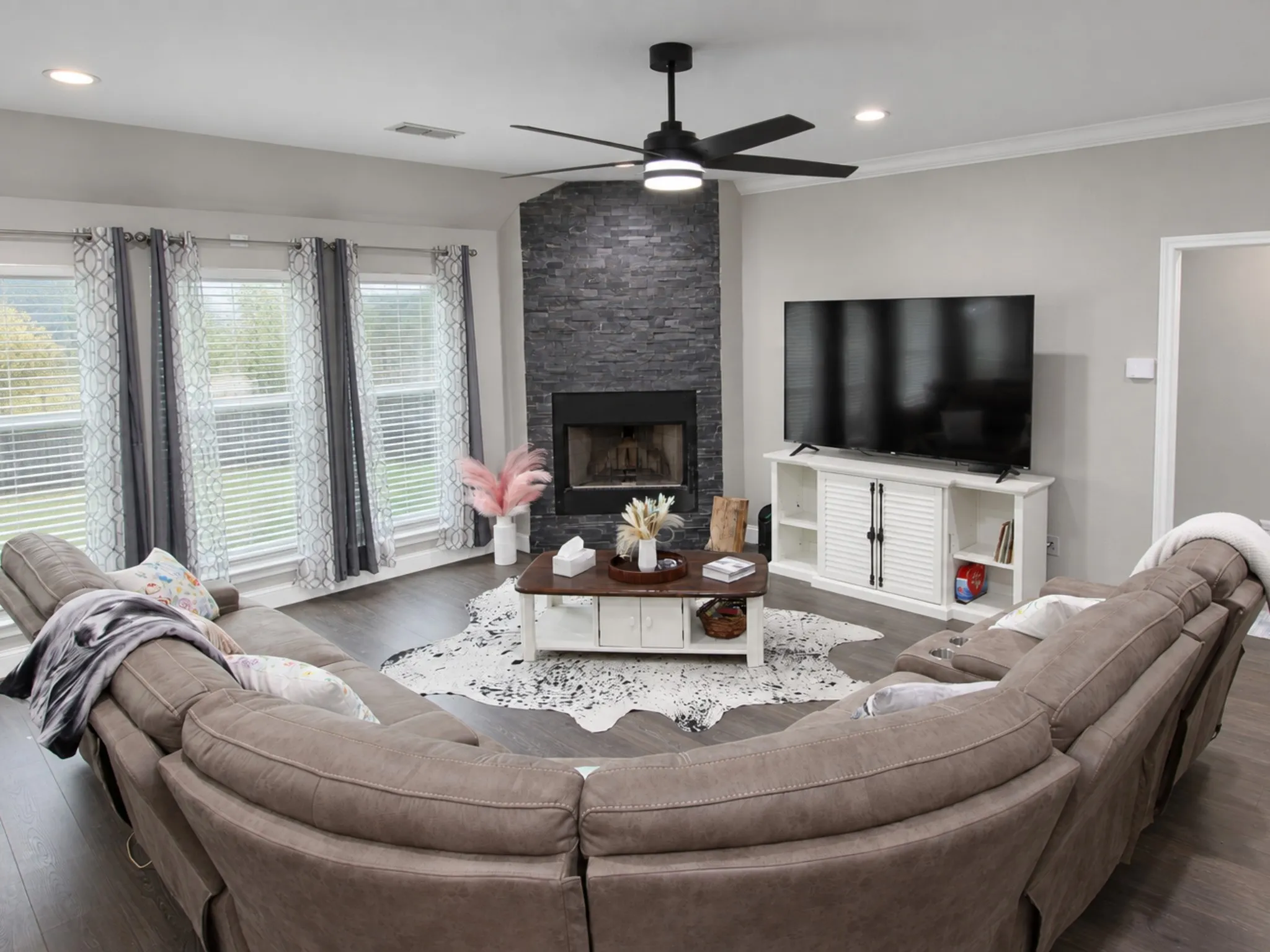 Corner fireplace with stone-finish surround