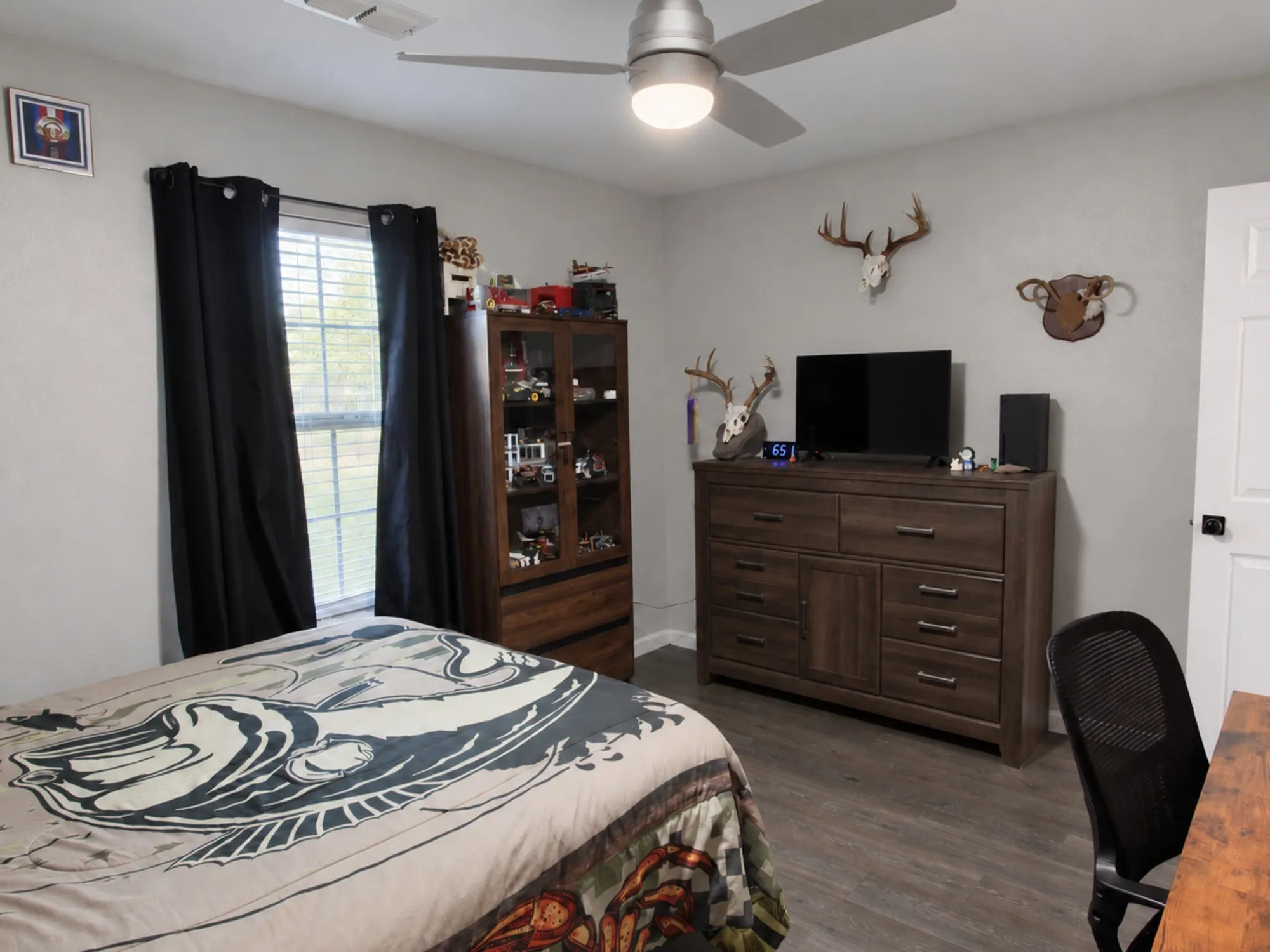 Neutral-toned walls complement wood-finish flooring