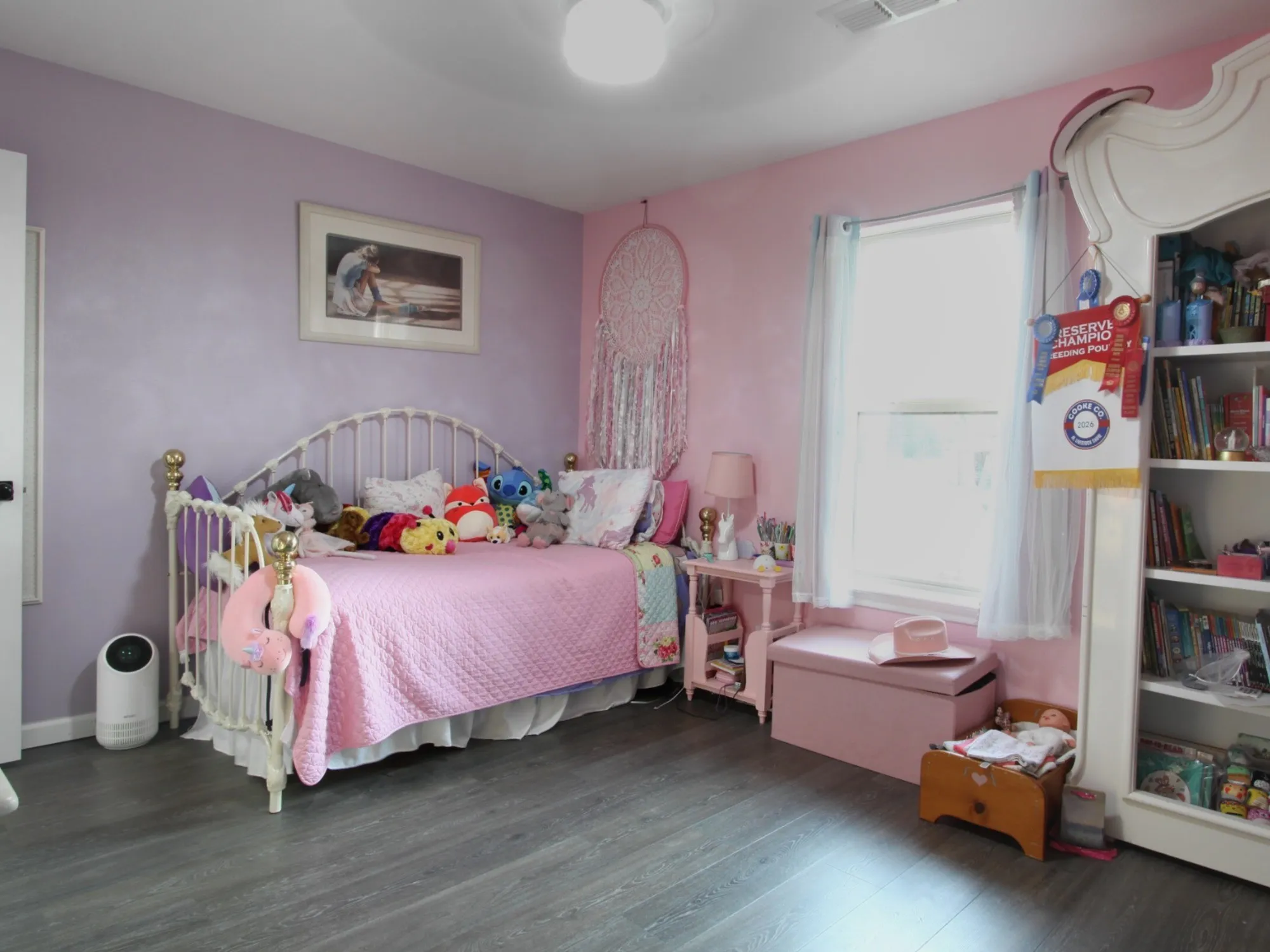 Wood-finish flooring with a ceiling-mounted light fixture