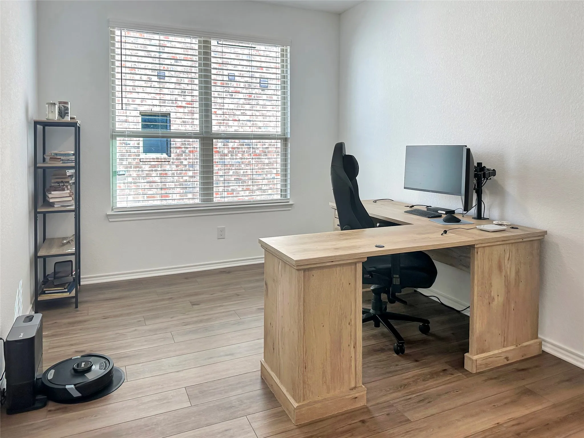 Office with hardwood / wood-style floors